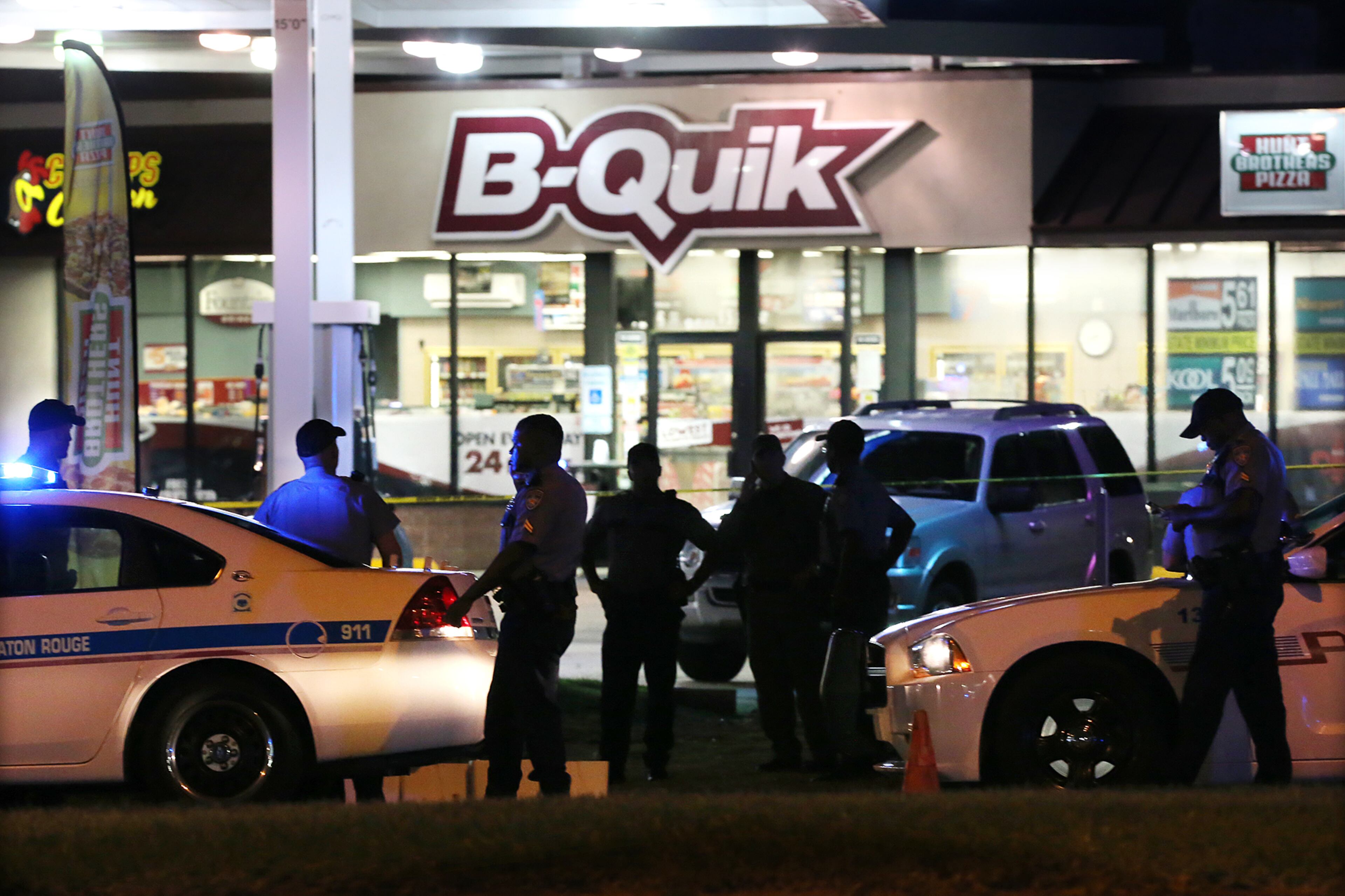 Law enforcement officials work the scene at the B-Quik gas station where three Baton Rouge police officers were killed on Sunday, July 17, 2016, in Baton Rouge. In a city already tense after a high-profile police shooting of an African-American man, three Baton Rouge police officers were killed and three others wounded. Curtis Compton /ccompton@ajc.com