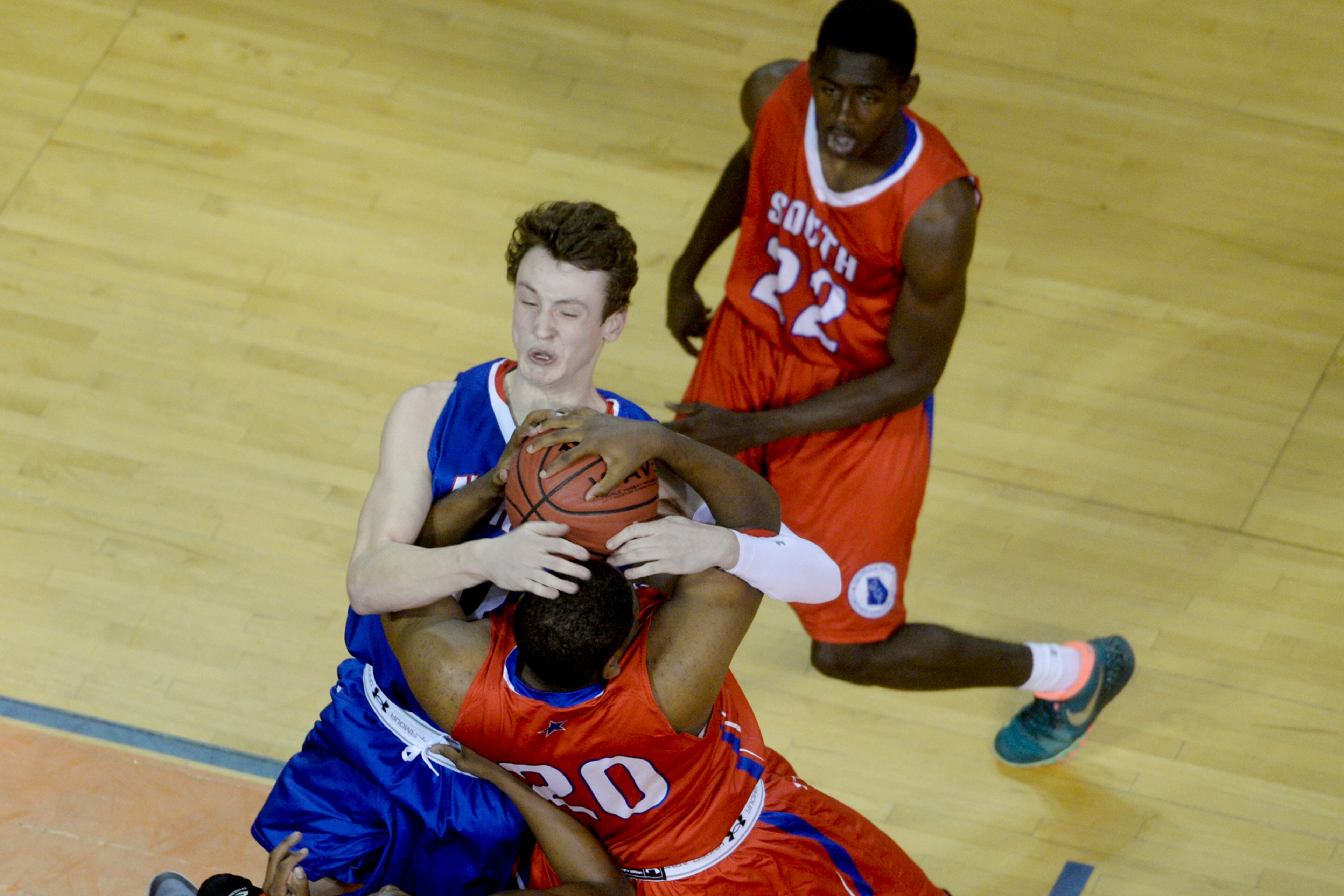 Lambert junior Ross Morkem and Washington County junior TiQuan Lewis wrestle for a rebound during the Georgia Athletic Coaches Association North-South All-Star Game at Savannah State in Savannah, Ga. on Saturday, March 21, 2015. (AP Photo/Savannah Morning News, Ian Maule)