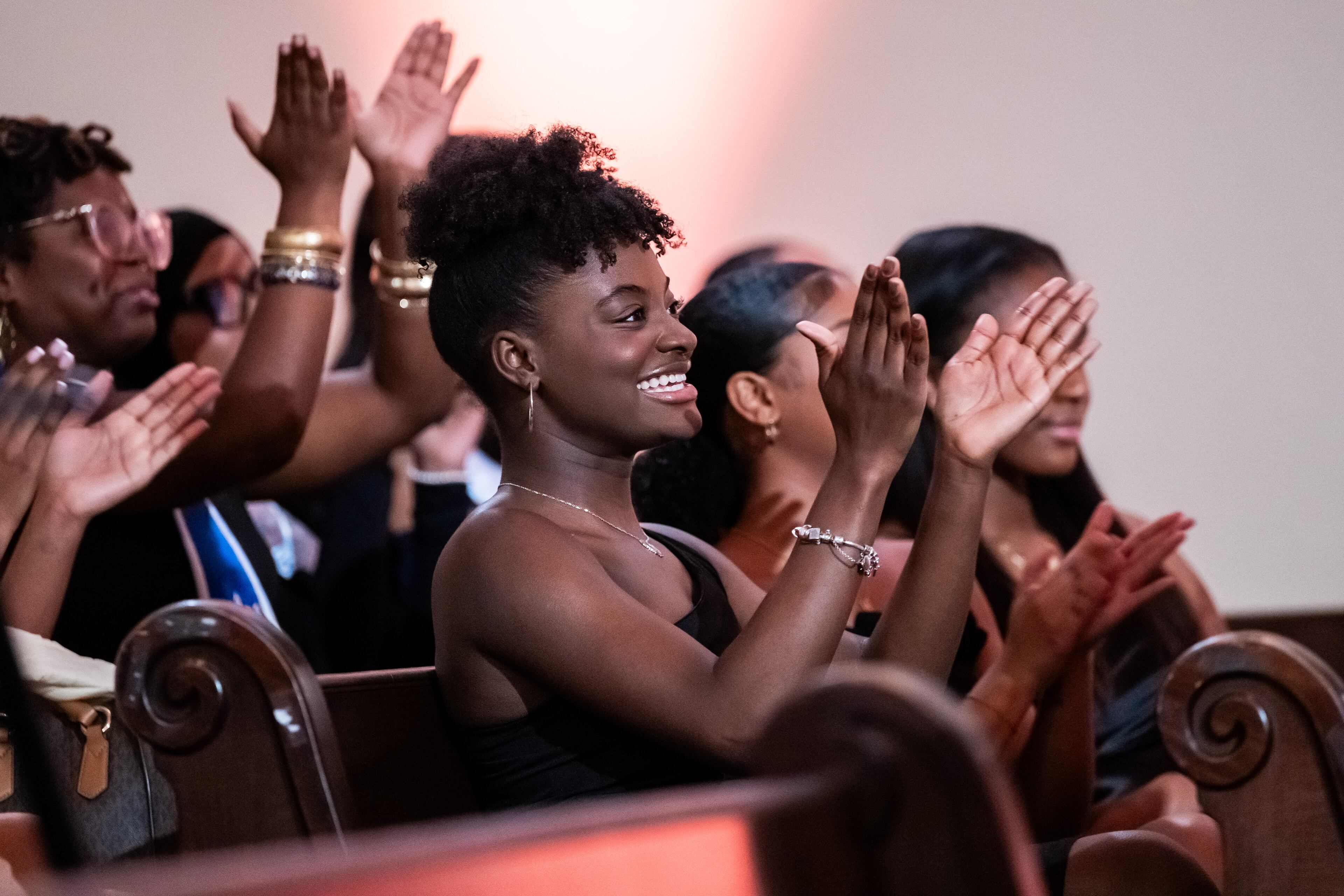 250412 ATLANTA, GA — 2023 Miss Spelman third attendant Nadia Scott applauds during the 42nd annual Miss Spelman pageant at Spelman College’s Sisters Chapel in Atlanta on Saturday, April 12, 2025.
(Bita Honarvar for The Atlanta Journal-Constitution)
