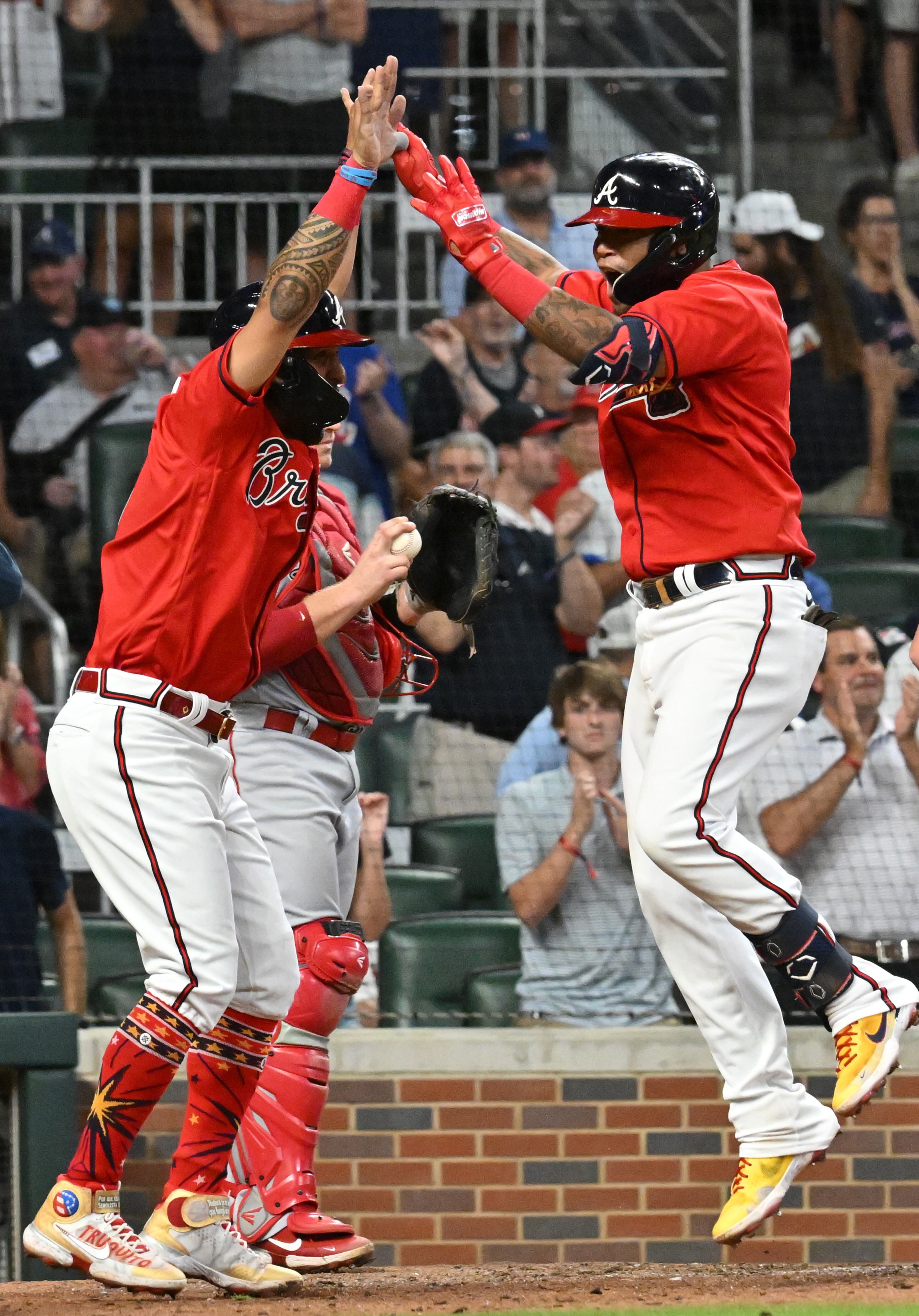 Braves' second baseman Orlando Arcia (11) celebrates his three-run home run in the 7th inning at Truist Park on Friday, July 22, 2022. Atlanta Braves won 8-1 over Los Angeles Angels. (Hyosub Shin / Hyosub.Shin@ajc.com)