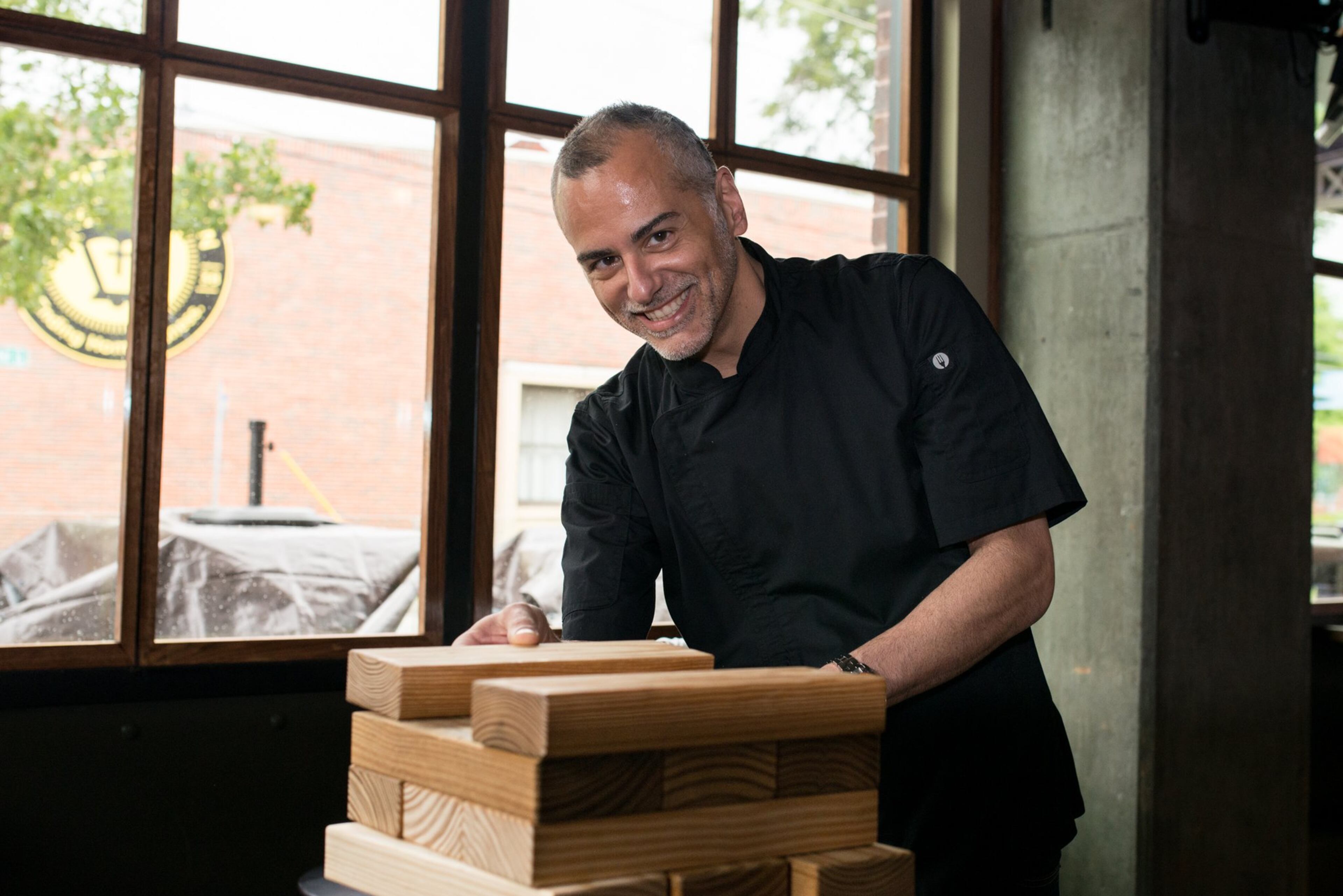 Grill Concepts' executive vice president of culinary, Phil Kastel, at Public School 404. Photo credit- Mia Yakel.