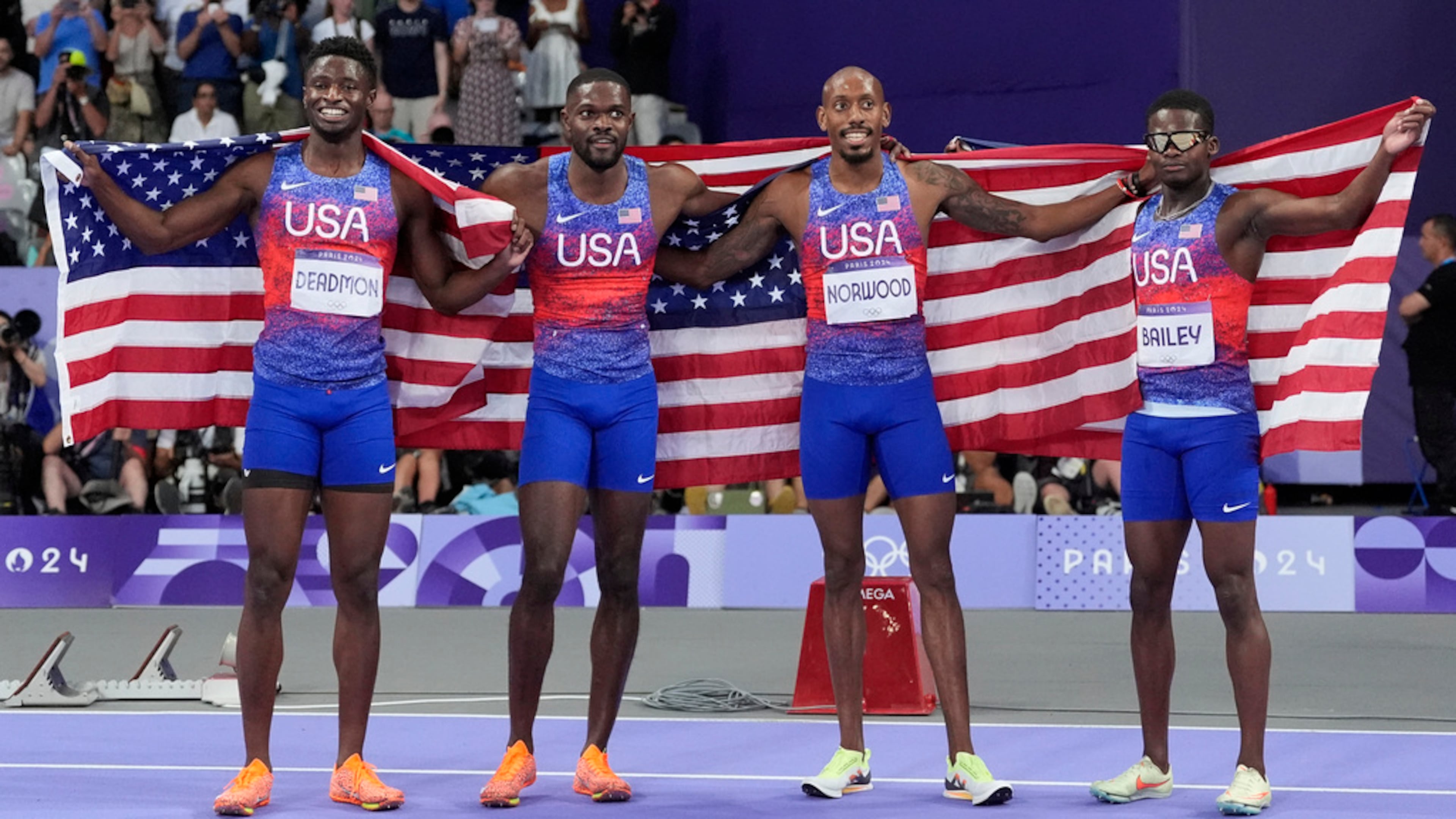 United States men's 4x400-meter relay team celebrate winning the final at the 2024 Summer Olympics, Saturday, Aug. 10, 2024, in Saint-Denis, France. (AP Photo/Matthias Schrader)