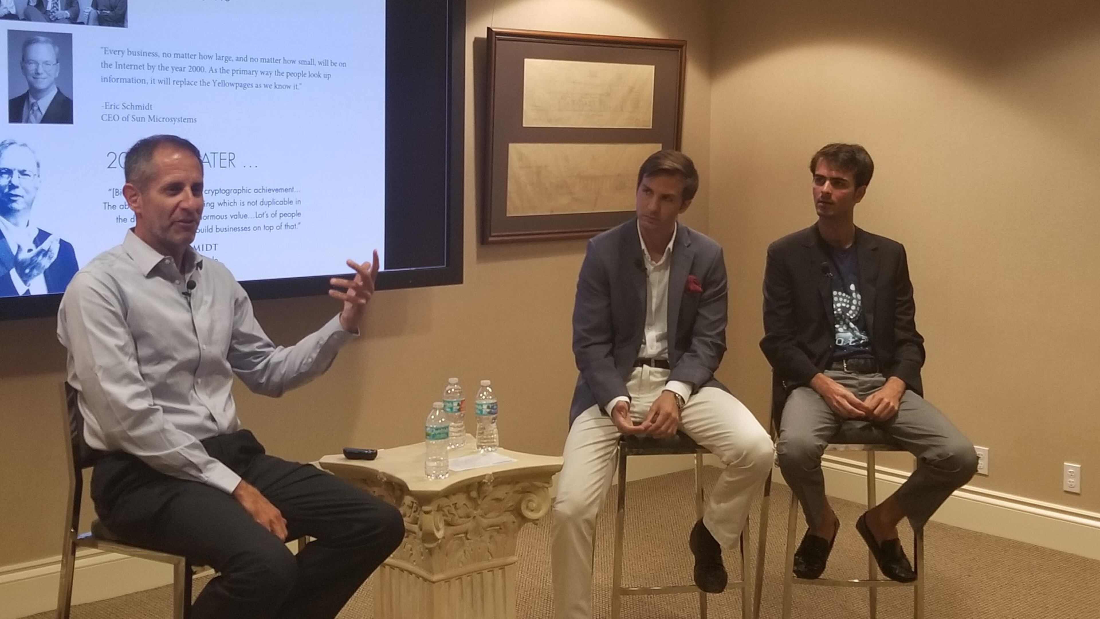 Tim Myers, left, Robert Riva and Michael Margaritoff talk to about 40 people about blockchain technology and cryptocurrencies during a seminar at the Preservation Foundation of Palm Beach. (Matt Morgan/Daily News)