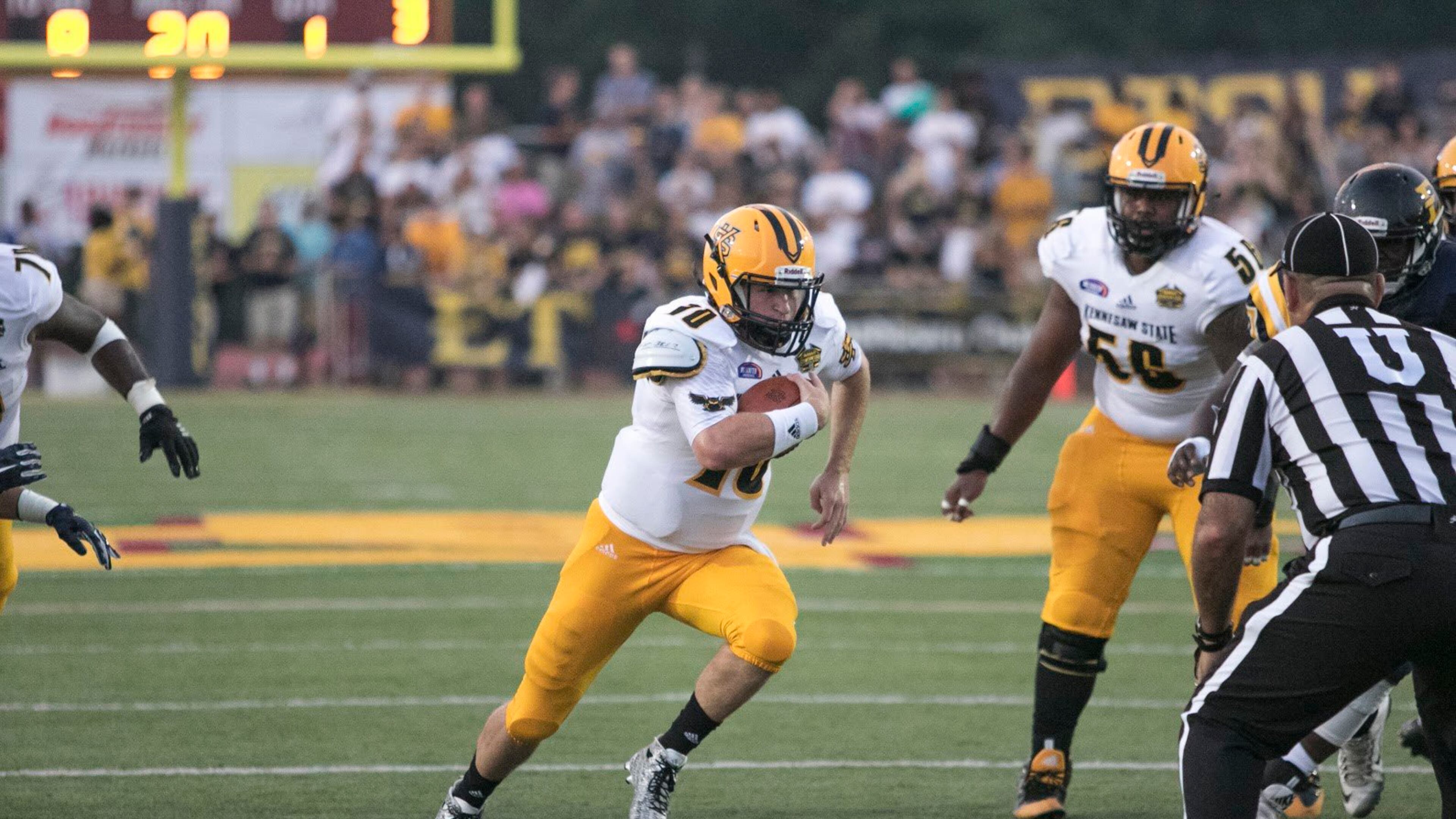 Kennesaw State’s Trey White runs through an opening. Photo by Collin Brooks