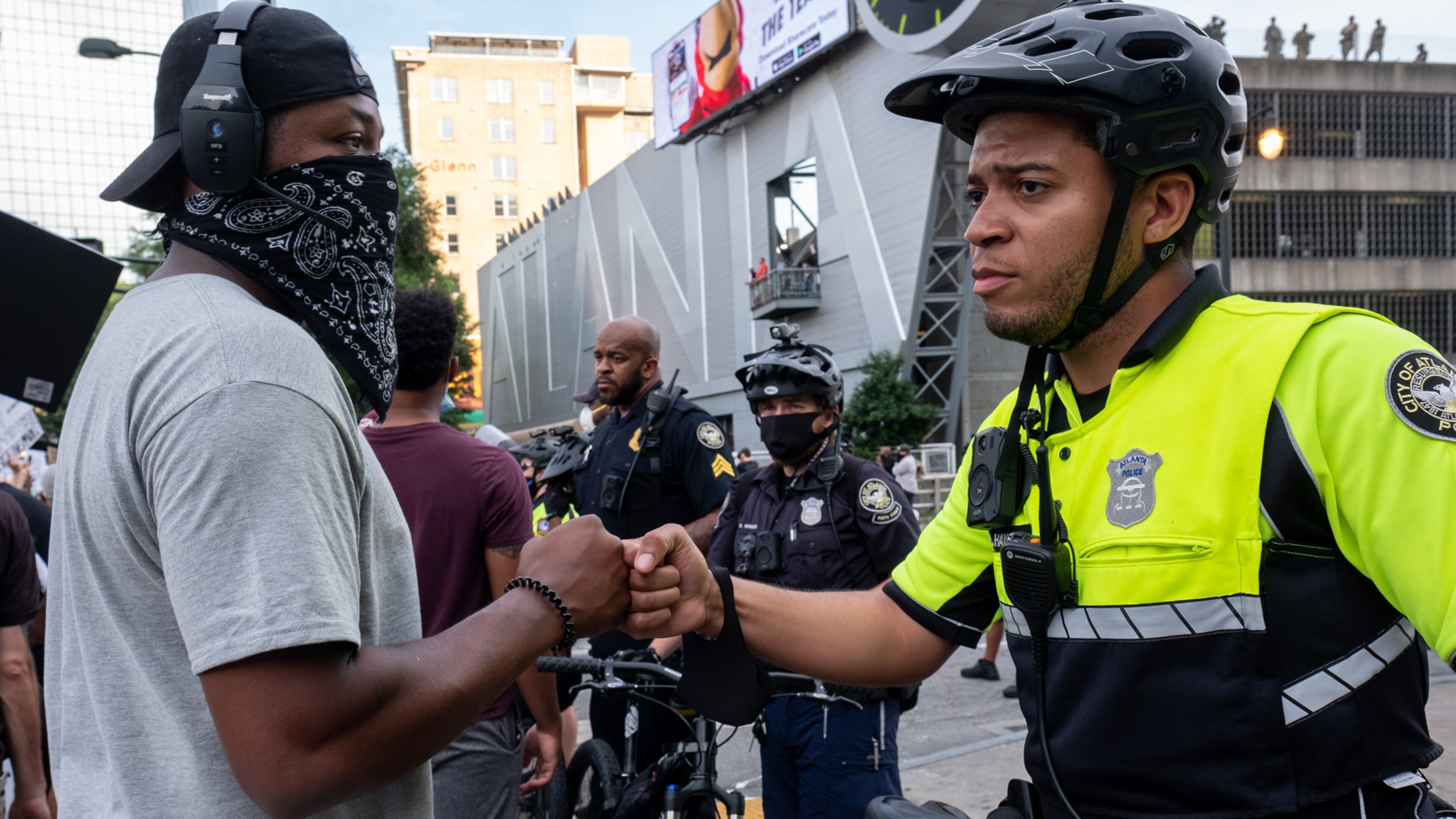 200603-Atlanta-Atlanta Police Officer Brandon Hayes fist bumps a demonstrator Wednesday evening June 3 in Downtown Atlanta after explaining that he became a police officer after Trayvon Martin was killed because he wanted to make a difference. Ben Gray for the Atlanta Journal-Constitution