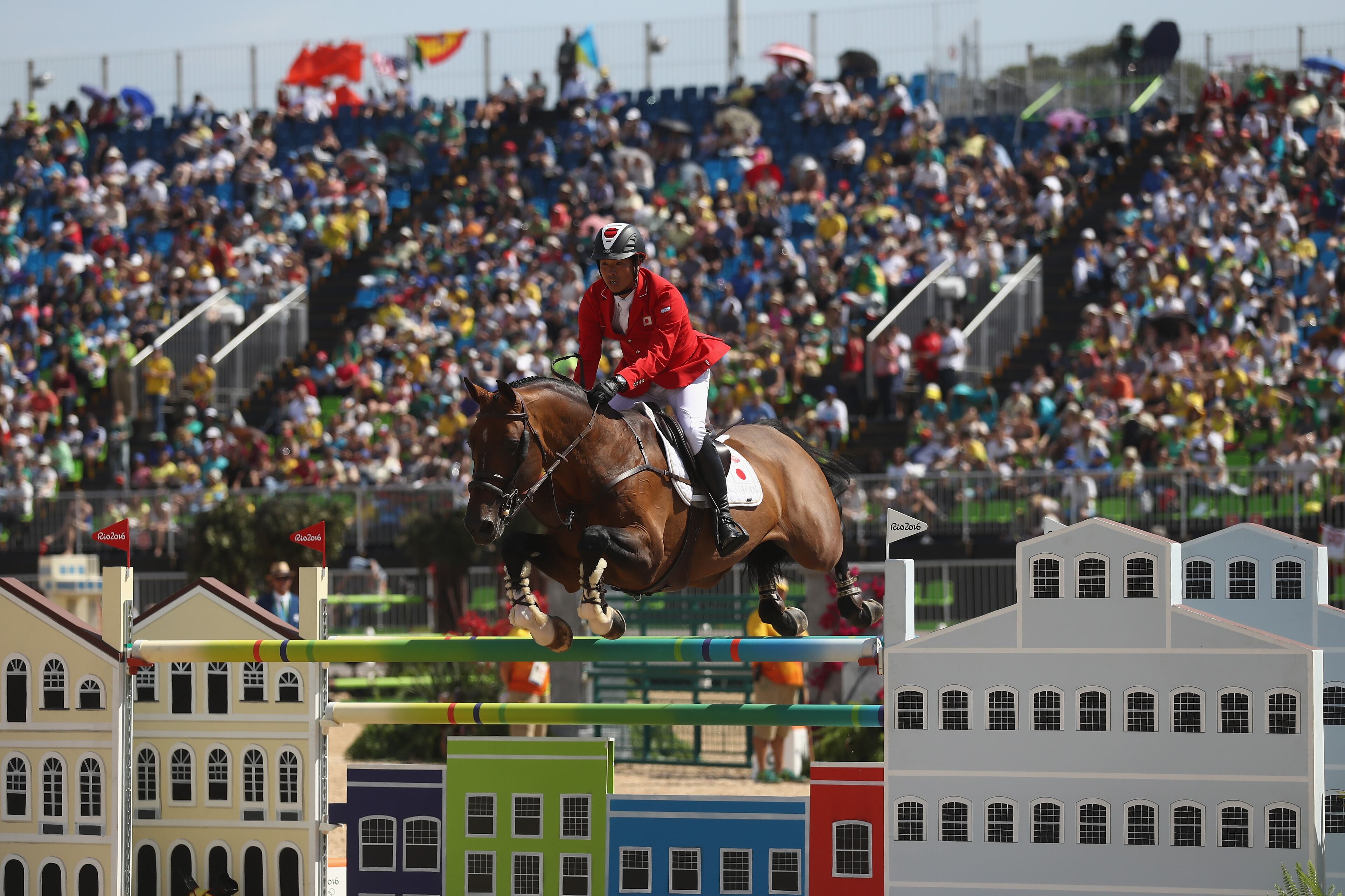 RIO DE JANEIRO, BRAZIL - AUGUST 16: Taizo Sugitano of Japan rides Imothep during the Team Jumping on Day 11 of the Rio 2016 Olympic Games at the Olympic Equestrian Centre on August 16, 2016 in Rio de Janeiro, Brazil. (Photo by Alexander Hassenstein/Getty Images)