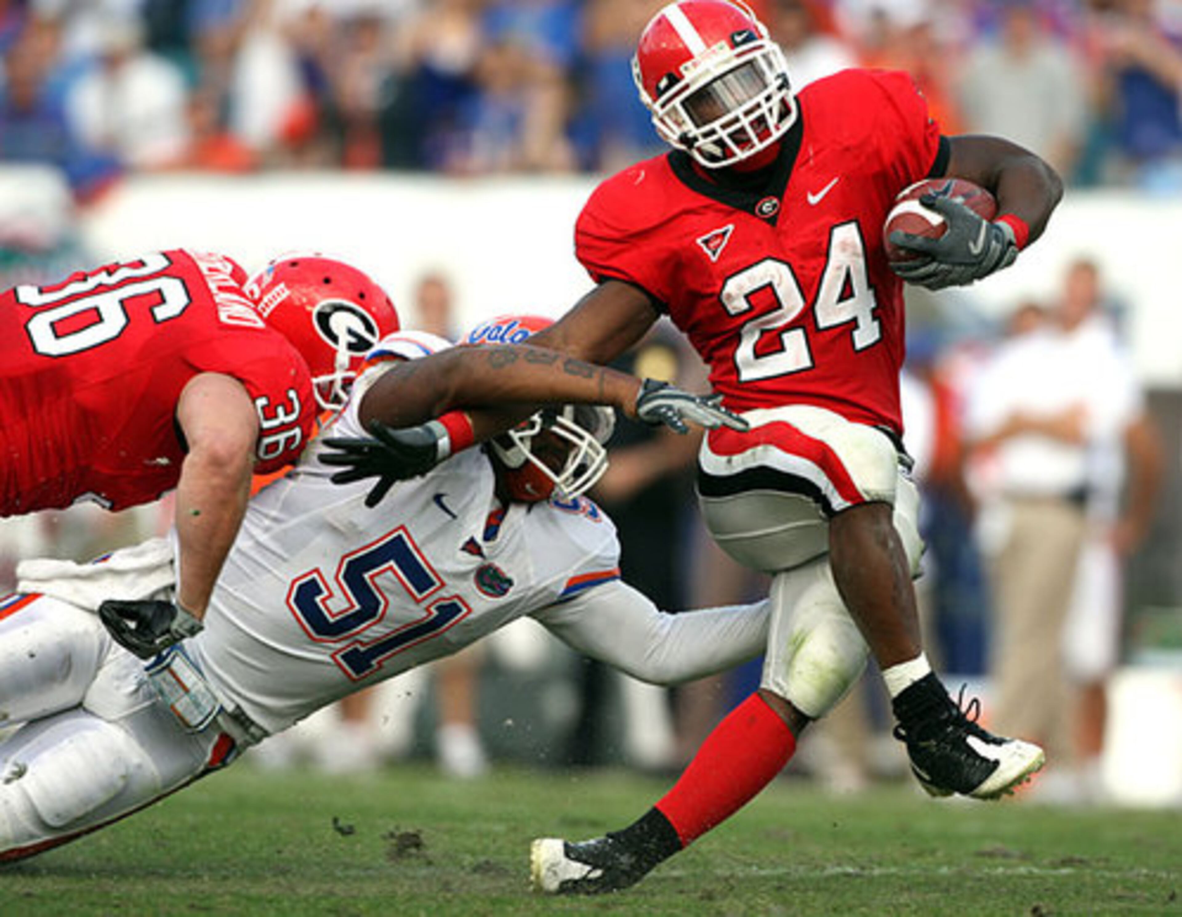 Georgia running back Knowshon Moreno (24) is tackled by Florida linebacker Brandon Spikes (51) after a nine yard gain during the 2nd quarter.