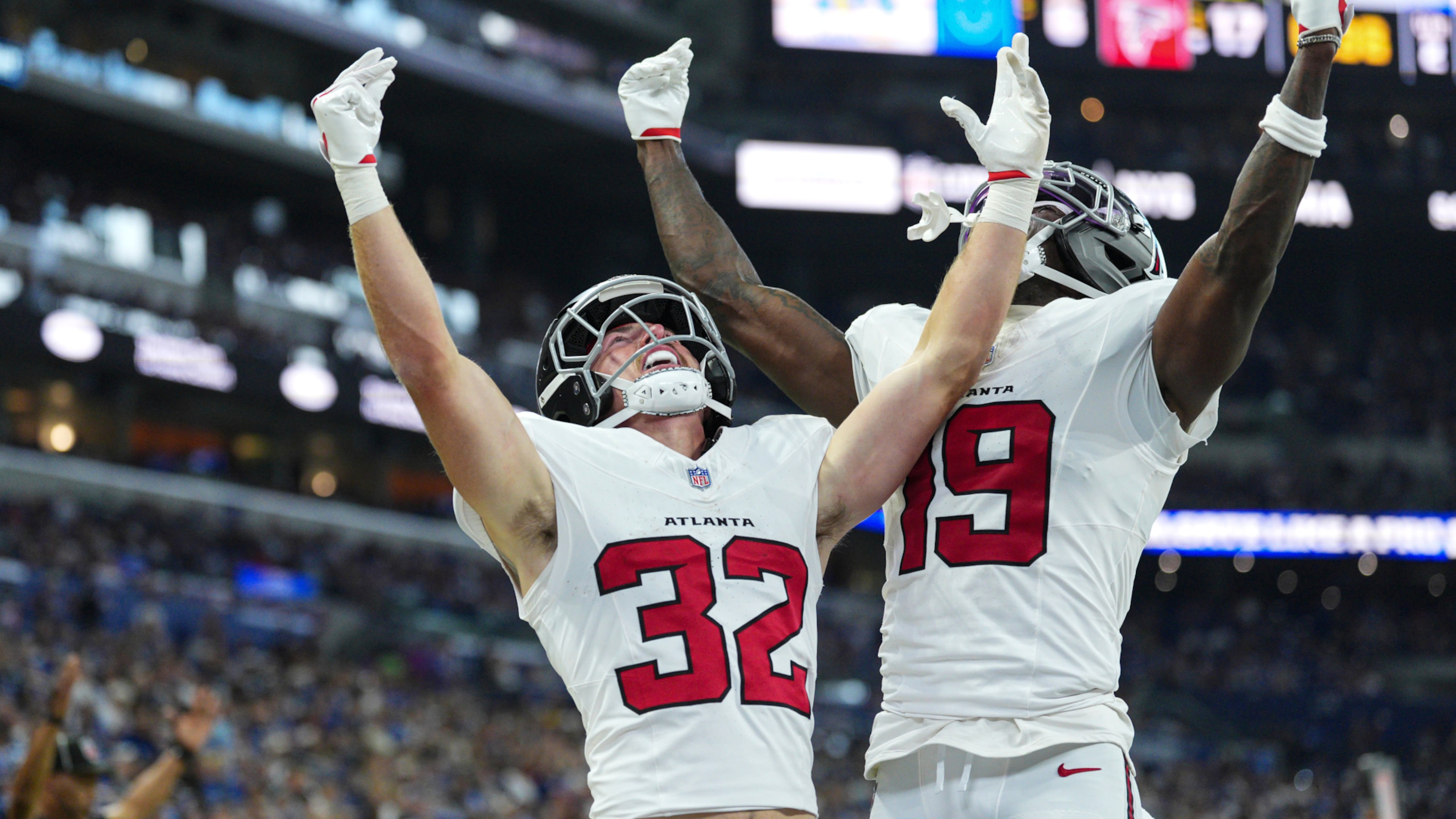 Atlanta Falcons running back Cash Jones (32) celebtes his touchdown with wide receiver Chris Blair (19) against the Indianapolis Colts during the first half of an NFL football game in Indianapolis, Saturday, Aug. 22, 2026. (AP Photo/AJ Mast)