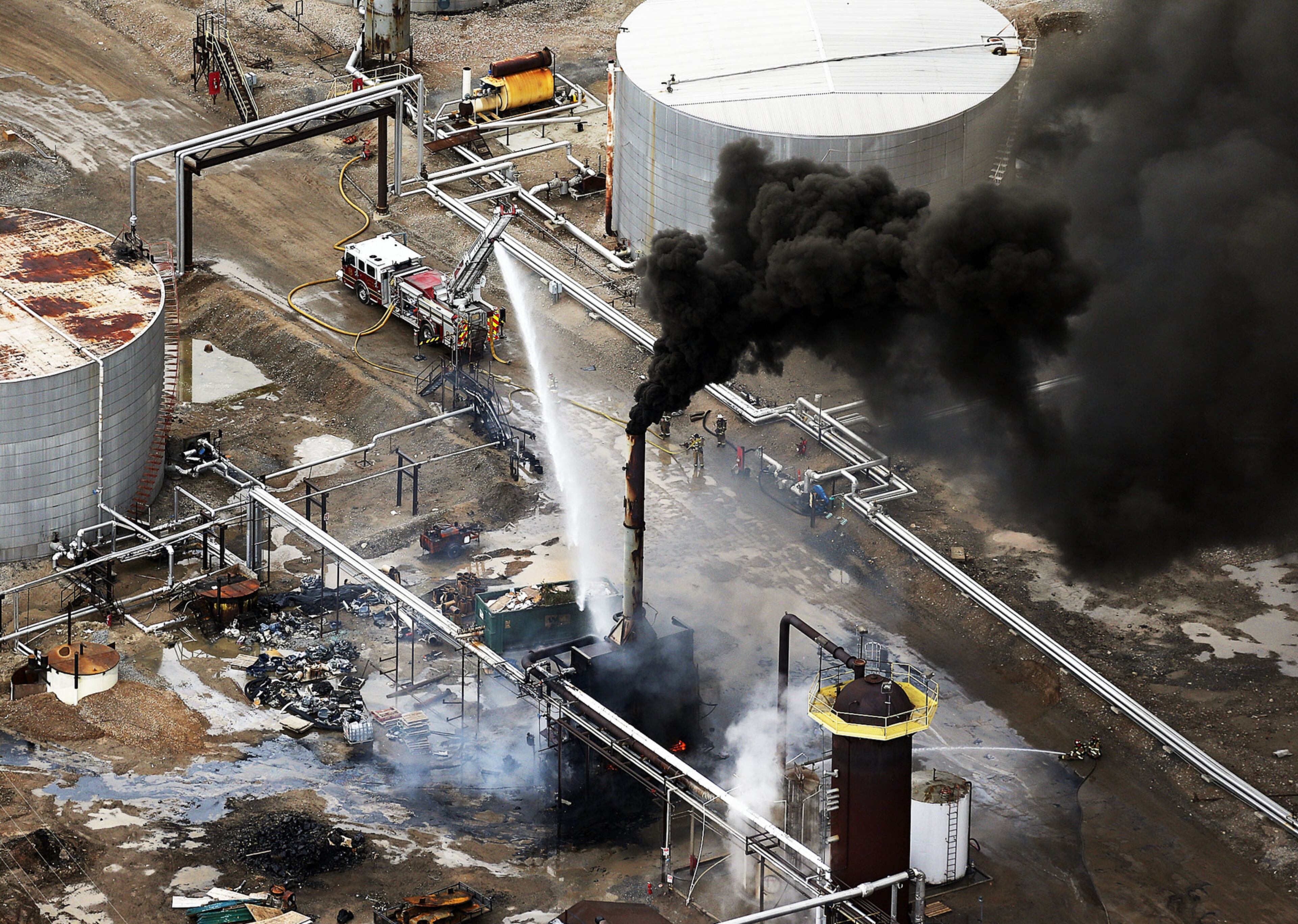 REFINERY FIRE--Firefighters battle a fire after an asphalt storage tank caught fire at the Foreland Refinery in Woods Cross, Utah, Tuesday, April 26, 2016. There were no evacuations or injuries, police said. (Ravell Call/The Deseret News via AP)