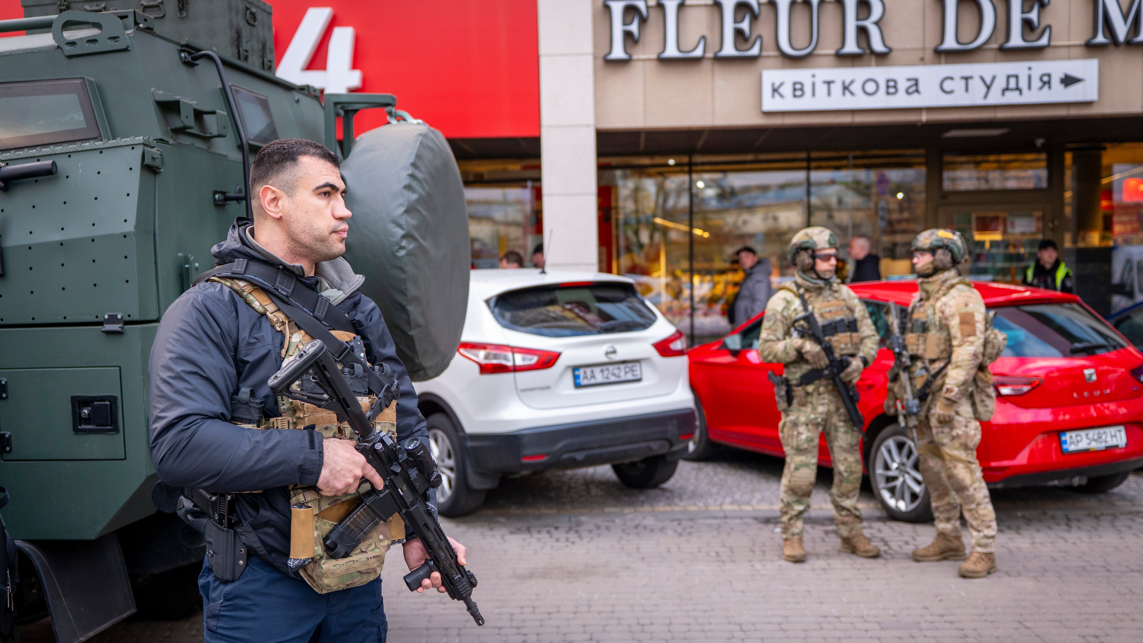 Police officers are seen at the site where a gunman killed at least six people in the streets before being shot dead by police, in Kyiv, Ukraine, Saturday, April 18, 2026. (AP Photo/Dan Bashakov)
