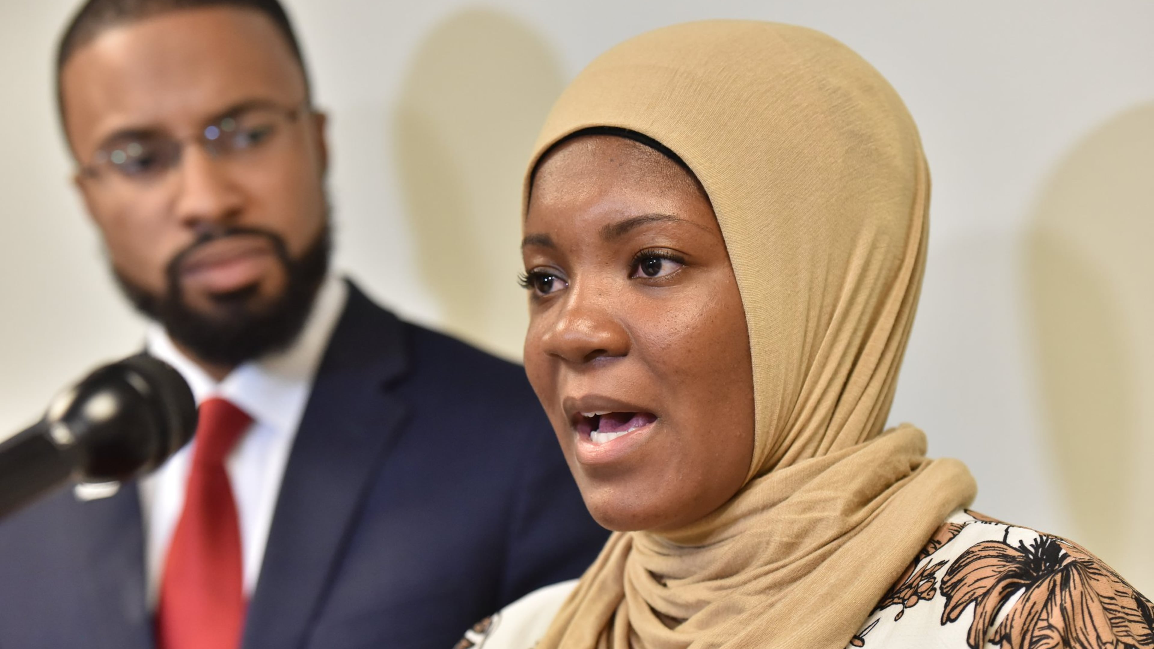 Jalanda Calhoun, a female Muslim correctional officer, filed a complaint with the Georgia Commission on Equal Opportunity, alleging prison officials in Reidsville will not let her wear the hijab. Calhoun is with Edward Ahmed Mitchell, attorney and executive director at CAIR-Georgia, during a news conference in Atlanta on Wednesday. HYOSUB SHIN / HSHIN@AJC.COM