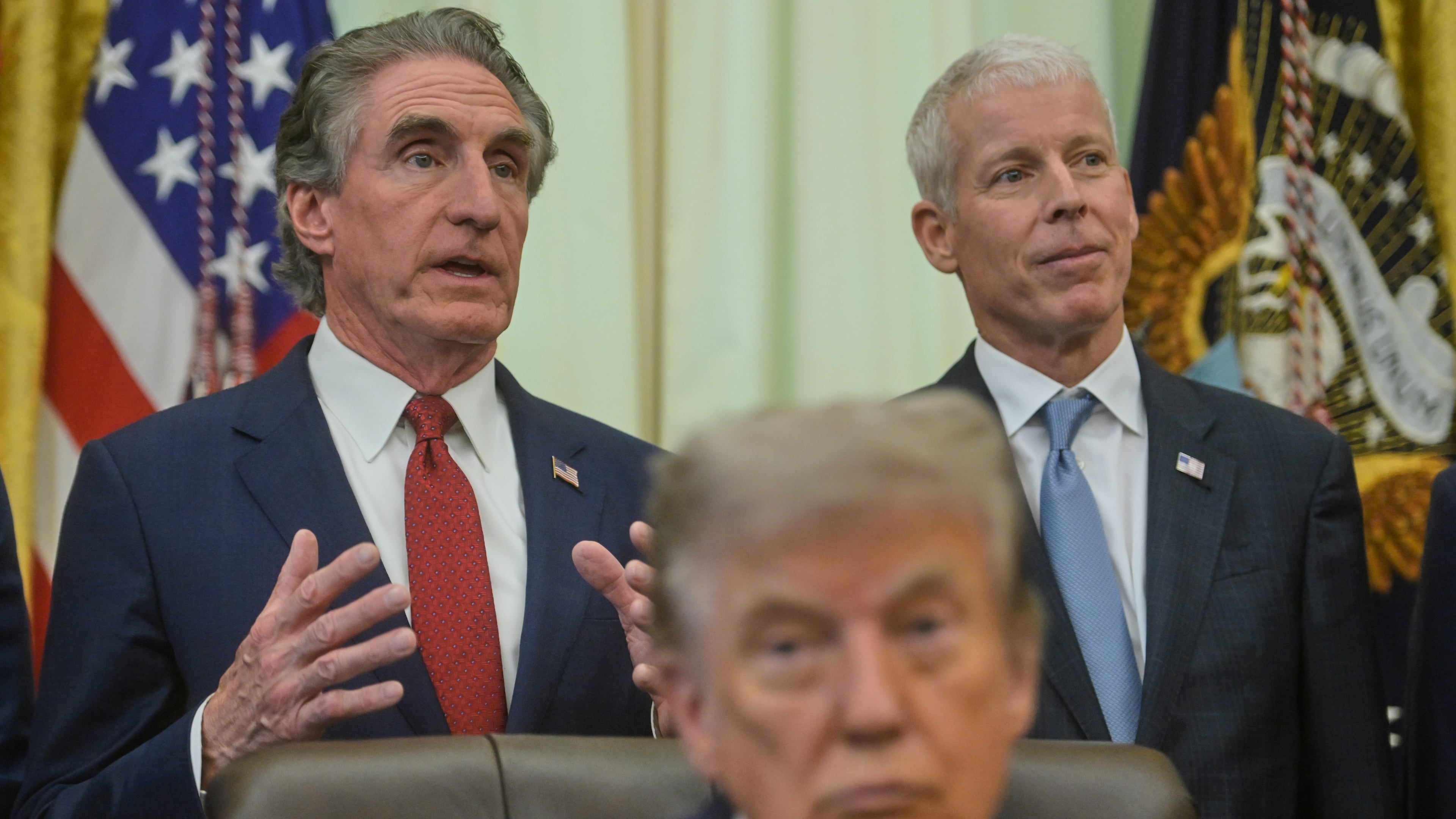 President Donald Trump and Energy Secretary Chris Wright listen as Interior Secretary Doug Burgum speaks in the Oval Office of the White House, Friday, July 24, 2026, in Washington. (AP Photo/Rod Lamkey, Jr.)