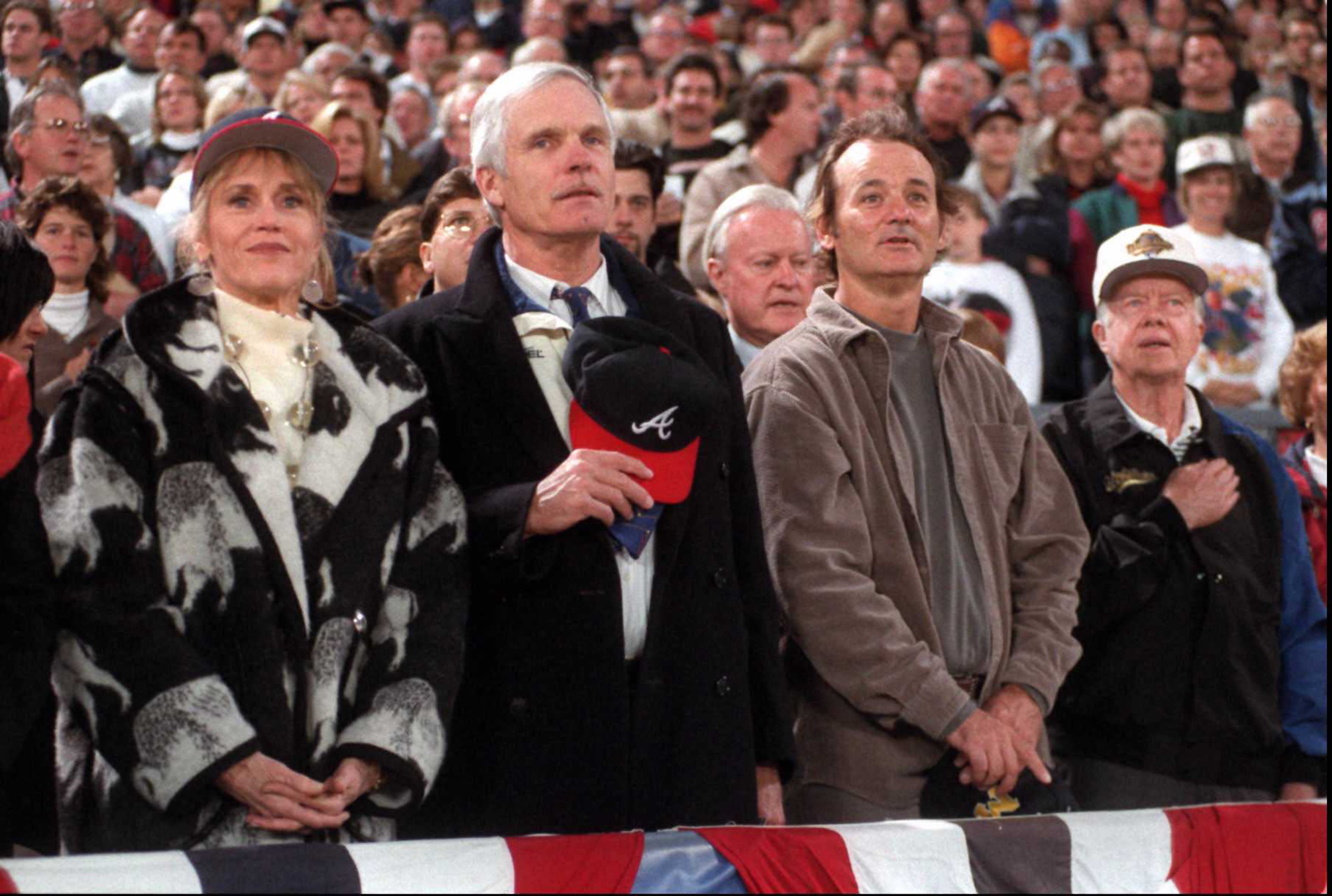 Standing for the national anthem prior to Game 6 (from left): Jane Fonda, Ted Turner, actor Bill Murray and former president Jimmy Carter. (From the files of the Atlanta Journal-Constitution)