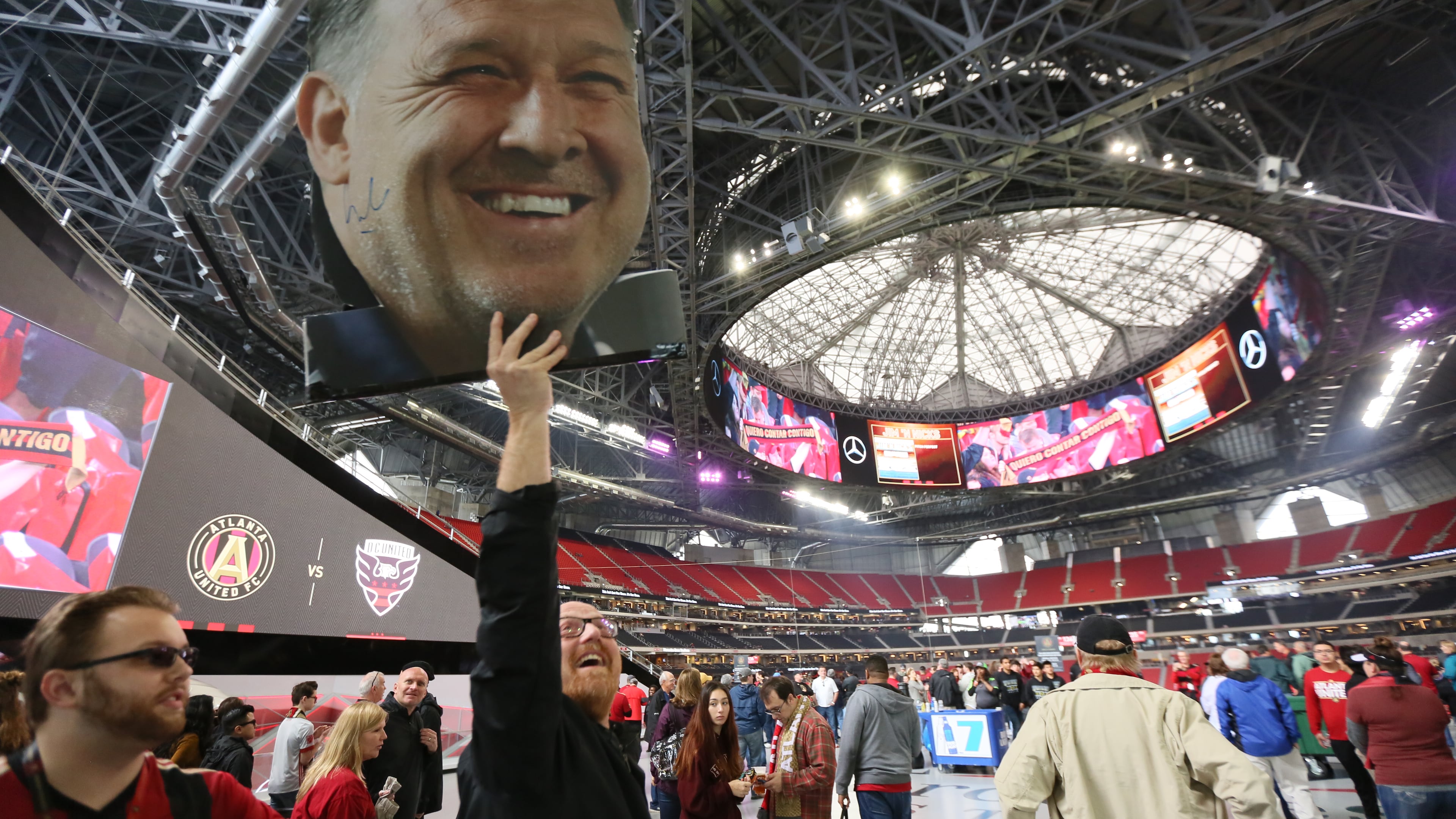 March 11, 2018. A founding member Tim Tewell from East Cobb shows his support to the Atlanta United holding a 'Tata' Martino banner from the 100 concourse ins of the Mercedes-Benz stadium on March 11, 2018 in Atlanta Ga.
