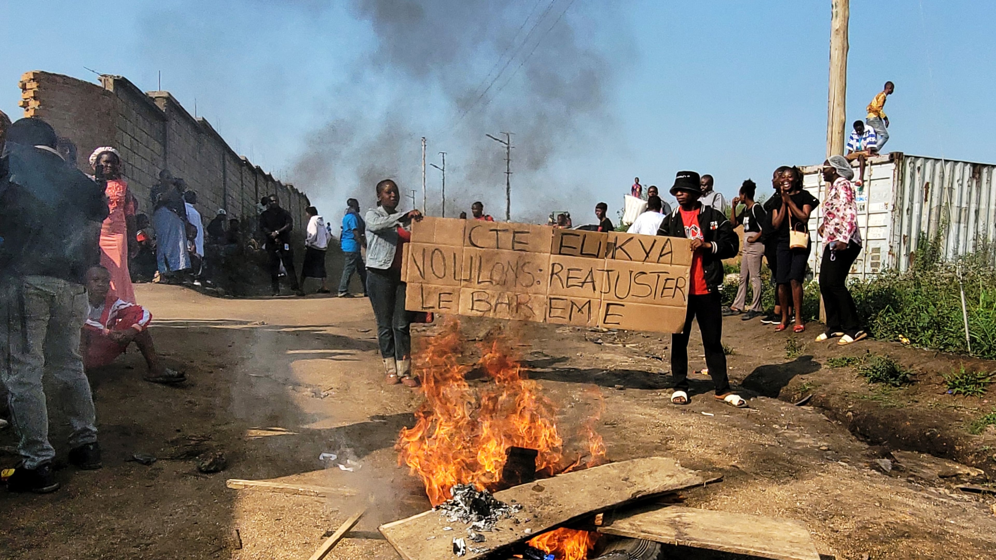 Rubble set on fire as health and frontline workers protest at the Elikya Ebola Treatment Center in Bunia, Congo, on Saturday, July 25, 2026. (AP Photo/Constant Same Bagalwa)