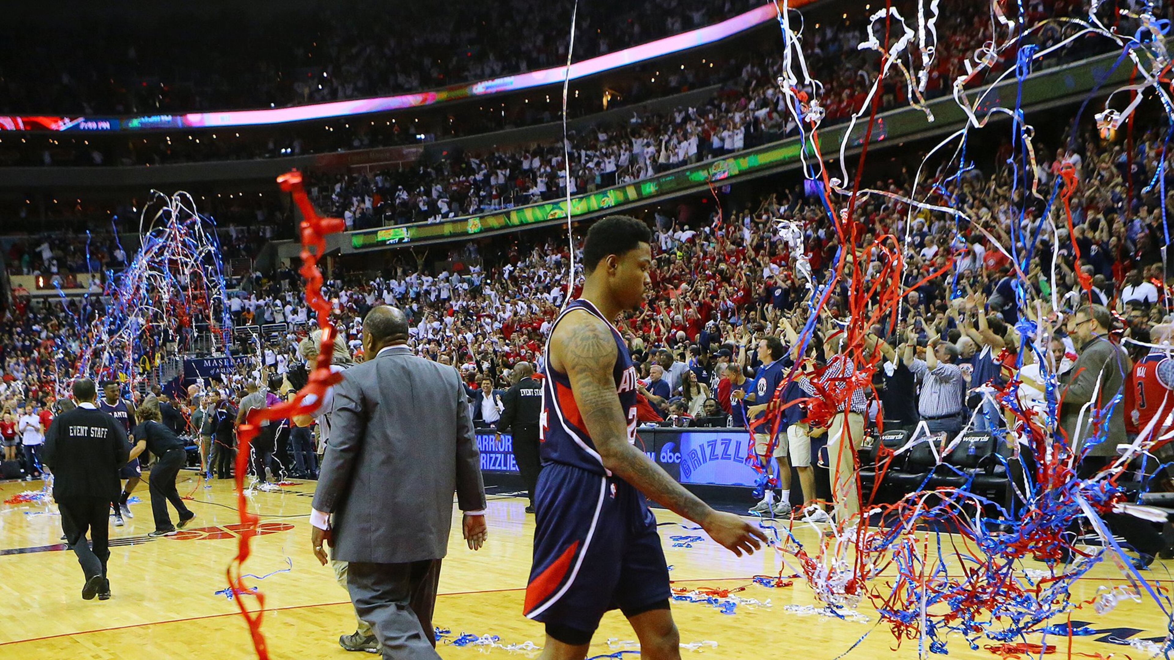 Streamers fall for the Wizards as the Hawks’ Kent Bazemore walks off the court after a 103-101 loss in Game 3 of the Eastern Conference semifinals at the Verizon Center on Saturday. (Curtis Compton/ccompton@ajc.com)