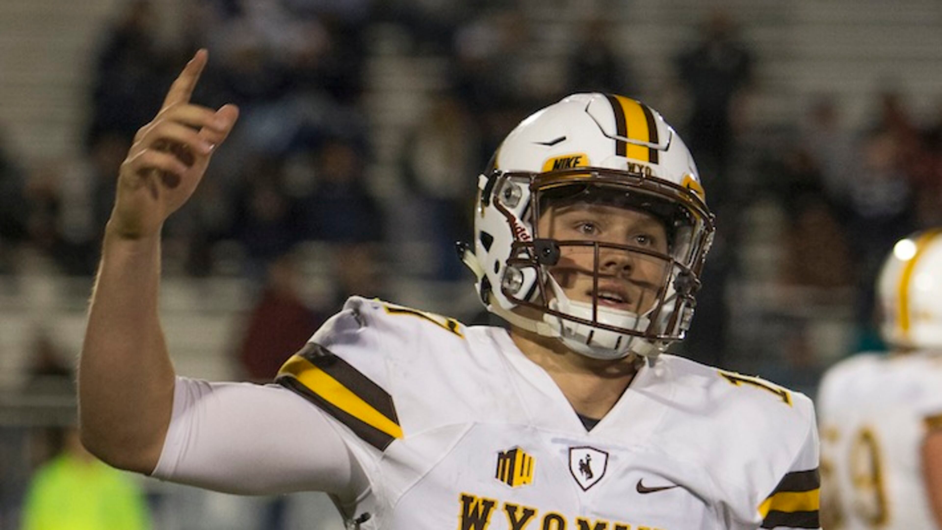 Wyoming quarterback Josh Allen reacts after scoring a touchdown in the second half of an NCAA college football game against Nevada on Saturday, Oct. 22, 2016 in Reno, Nev. (AP Photo/Tom R. Smedes)