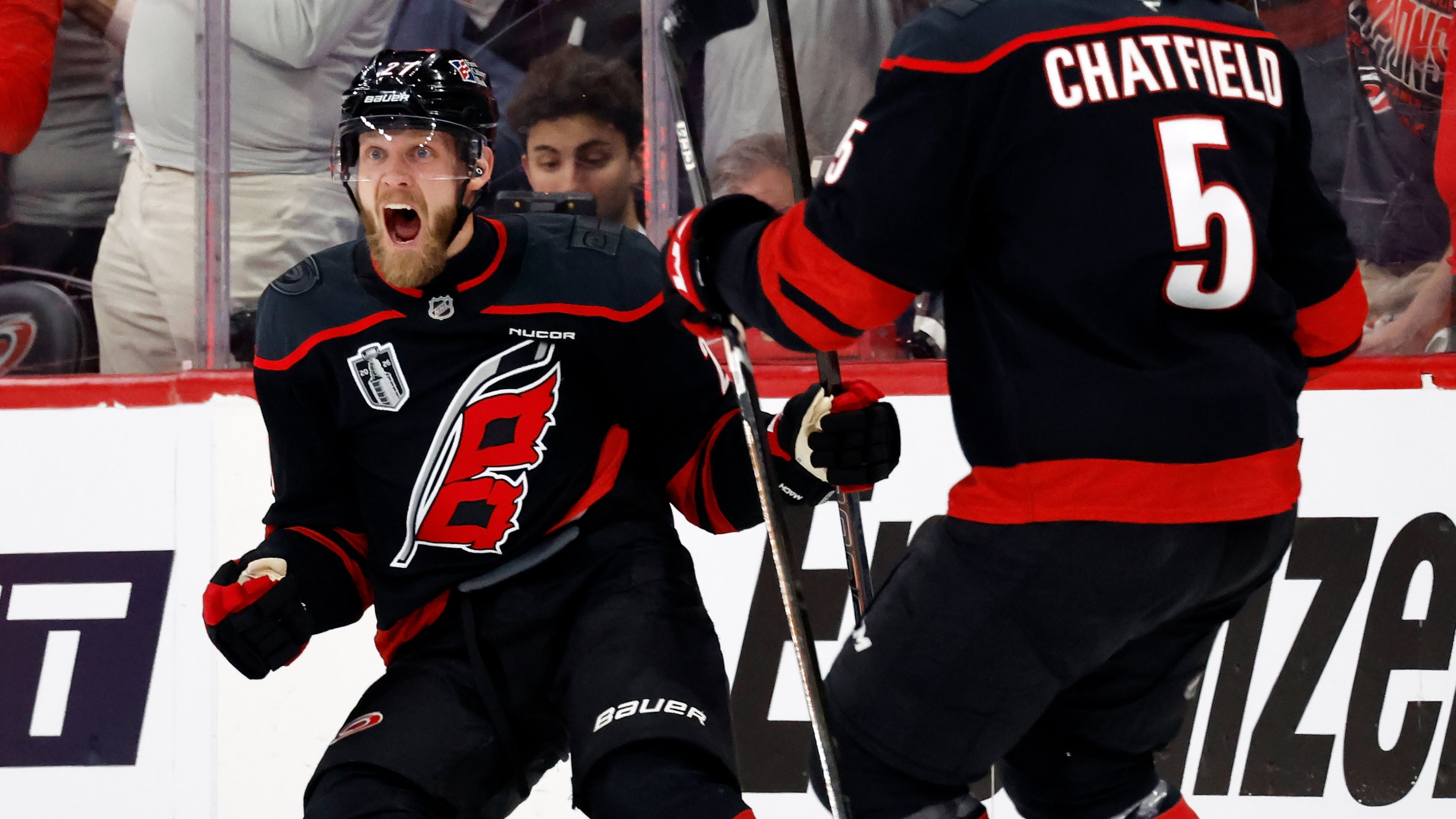 Carolina Hurricanes' Nikolaj Ehlers (27) celebrates his goal with Jalen Chatfield (5) during the first period in Game 1 of the NHL hockey Stanley Cup Final series against the Vegas Golden Knights in Raleigh, N.C., Tuesday, June 2, 2026. (AP Photo/Karl DeBlaker)