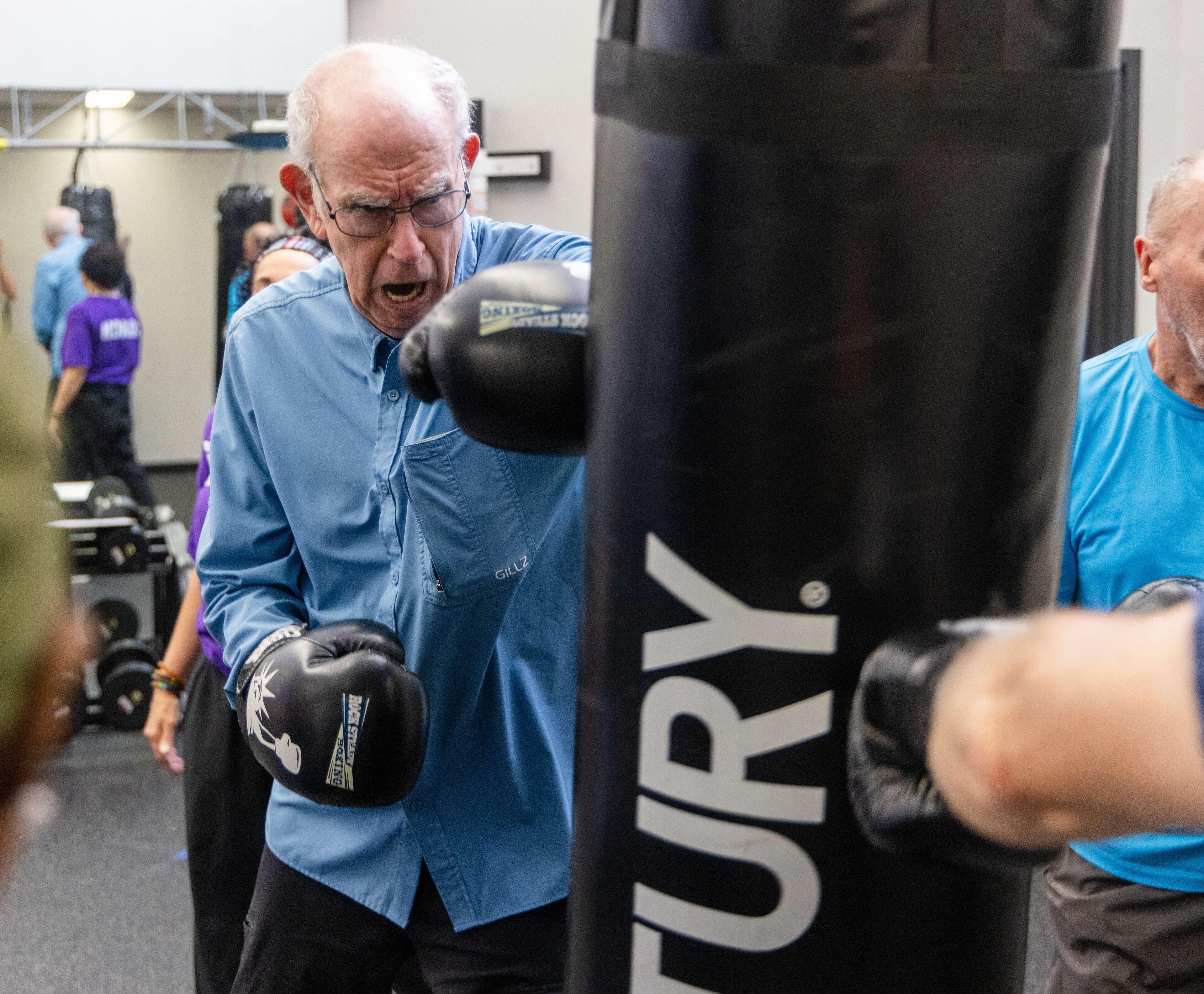 Frank Ryan hits a punching bag in Rock Steady Boxing. He attends the class four times a week and believes that's helping to delay the progression of his Parkinson's disease. The classes are held at Wellstar Health Place on the campus of Kennestone Hospital. Rock Steady Boxing doesn't take insurance, but some insurers will reimburse participants on a case-by-case basis.
PHIL SKINNER FOR THE ATLANTA JOURNAL-CONSTITUTION