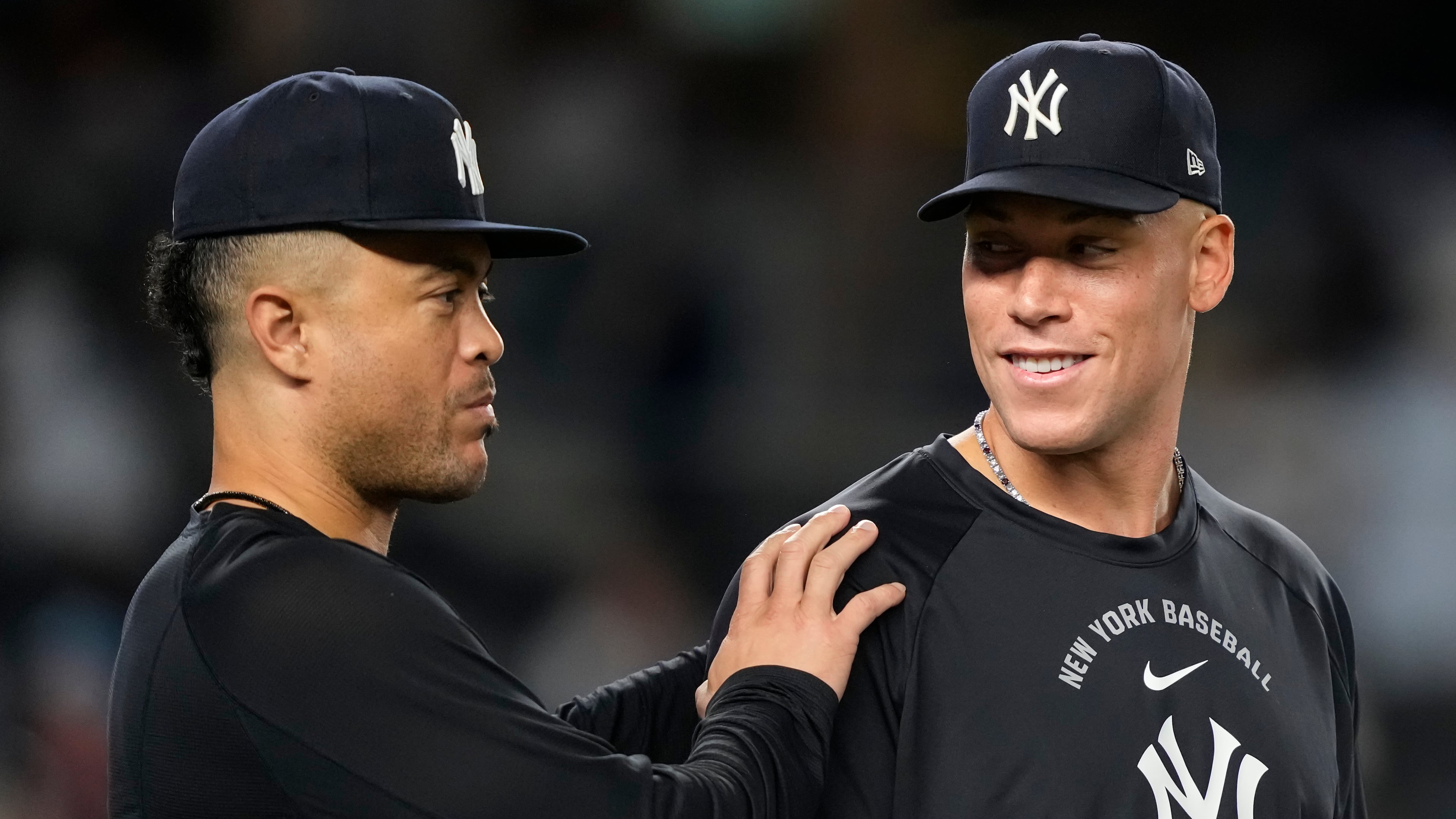New York Yankees' Aaron Judge, right, and Giancarlo Stanton, left, celebrate after winning a baseball game against the Boston Red Sox, Friday, Aug. 28, 2026, in New York. (AP Photo/Yuki Iwamura)