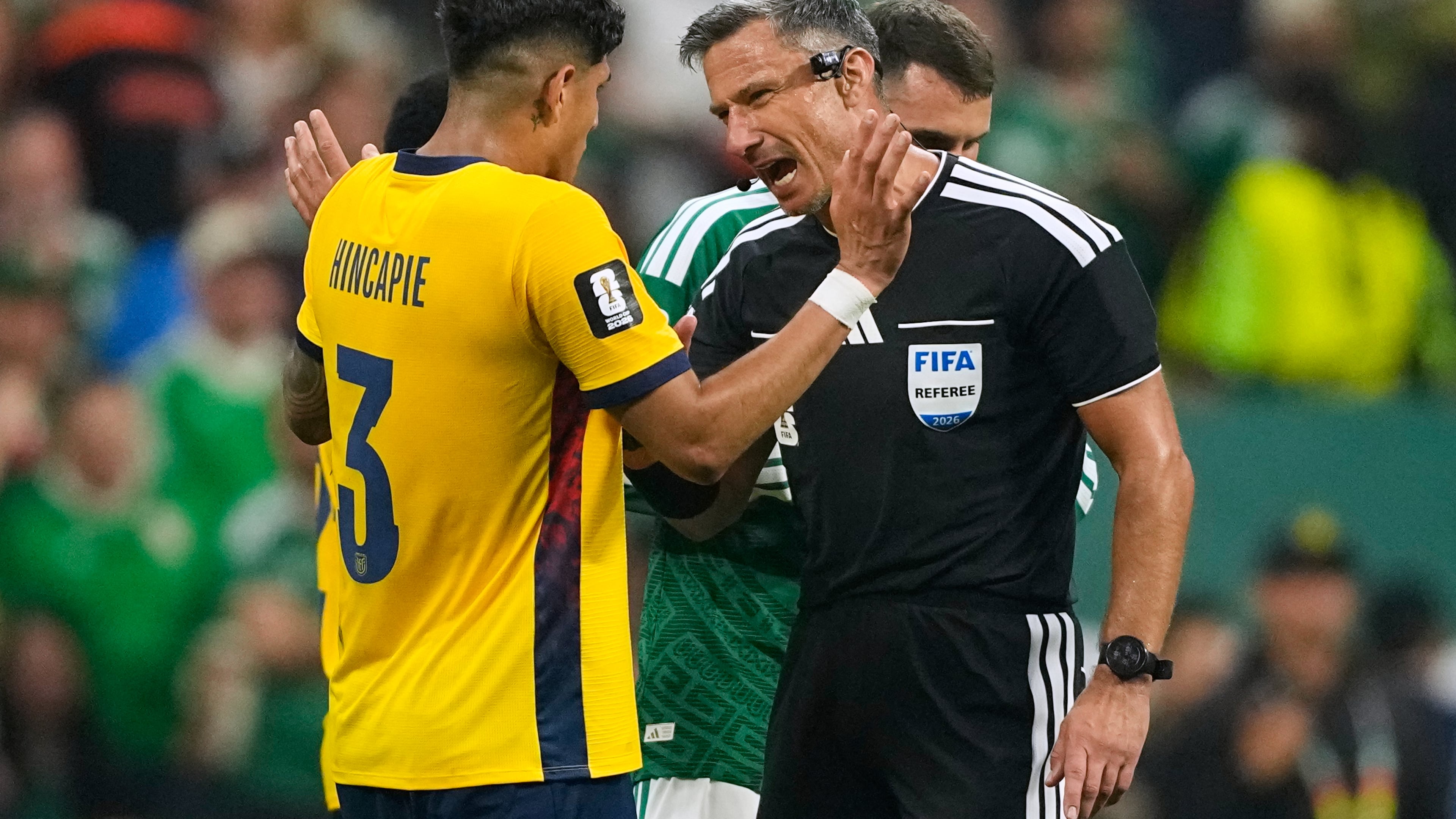Referee Slavko Vincic of Slovenia speaks to Ecuador's Piero Hincapie (3) before sending him from the field during the World Cup round of 32 soccer match between Mexico and Ecuador in Mexico City, Tuesday, June 30, 2026. (AP Photo/Natacha Pisarenko)