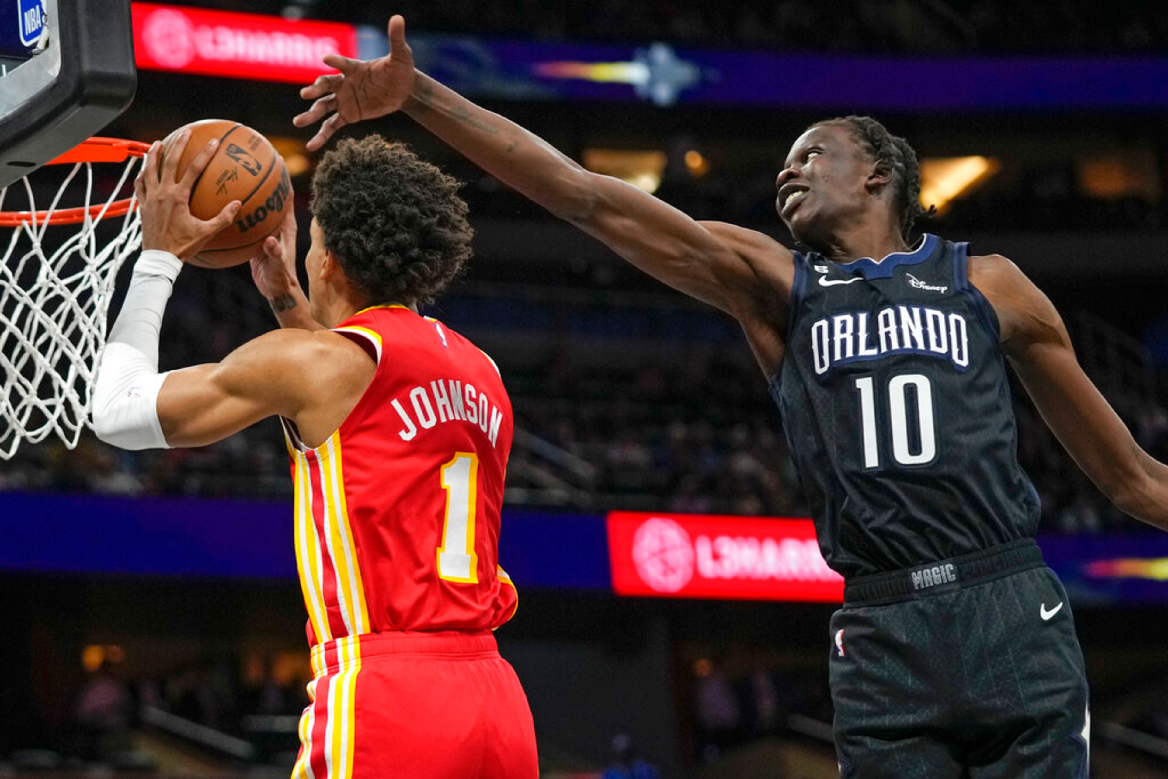 Atlanta Hawks' Jalen Johnson (1) goes past Orlando Magic's Bol Bol (10) for a shot during the first half of an NBA basketball game, Wednesday, Dec. 14, 2022, in Orlando, Fla. (AP Photo/John Raoux)