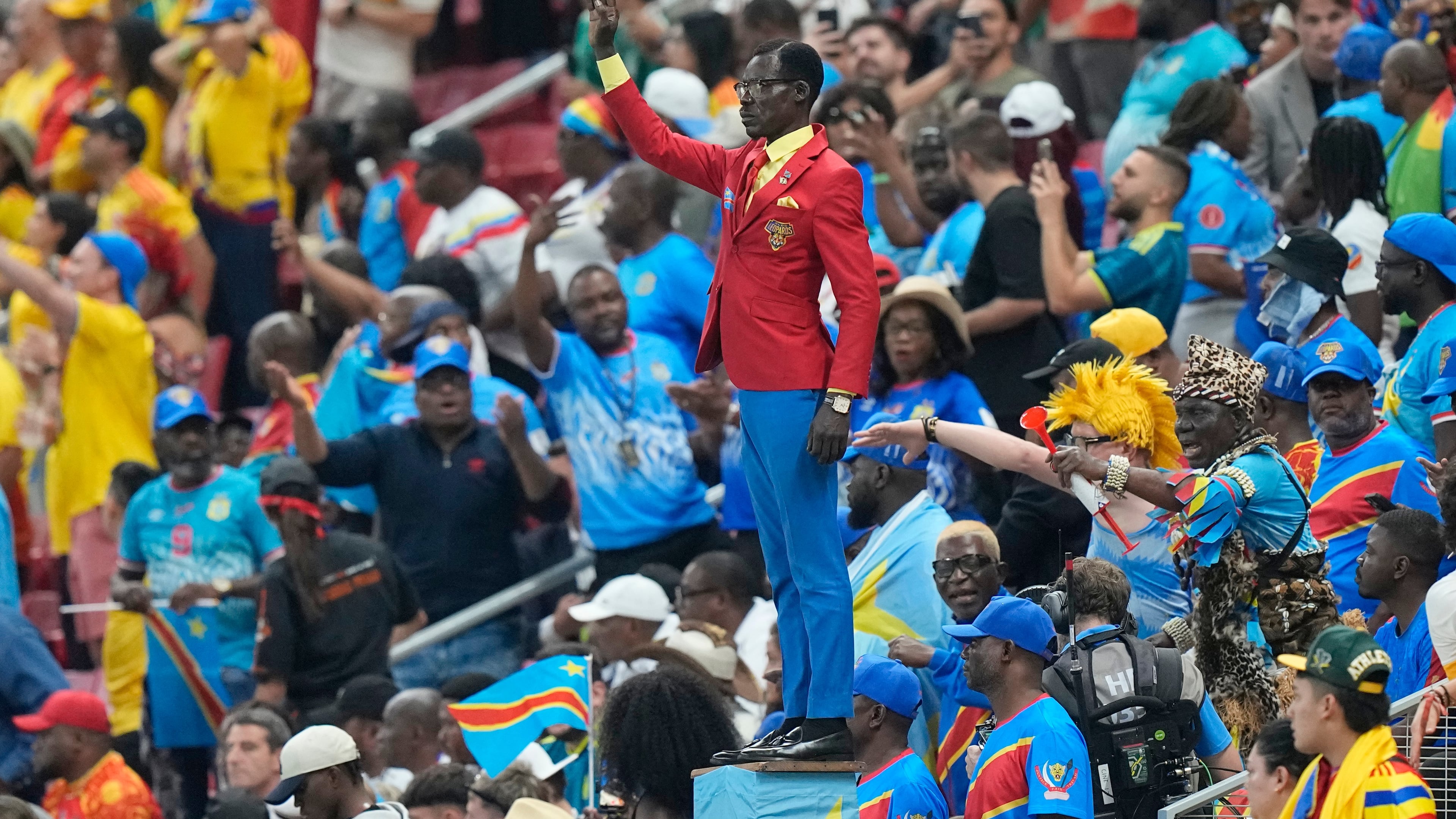 Congo supporter Michel Nkuka Mboladinga poses as a statue of the country's assassinated independence hero Patrice Lumumba ahead of the World Cup match against Colombia in Mexico on Tuesday, June 23, 2026. (Fernando Llano/AP)