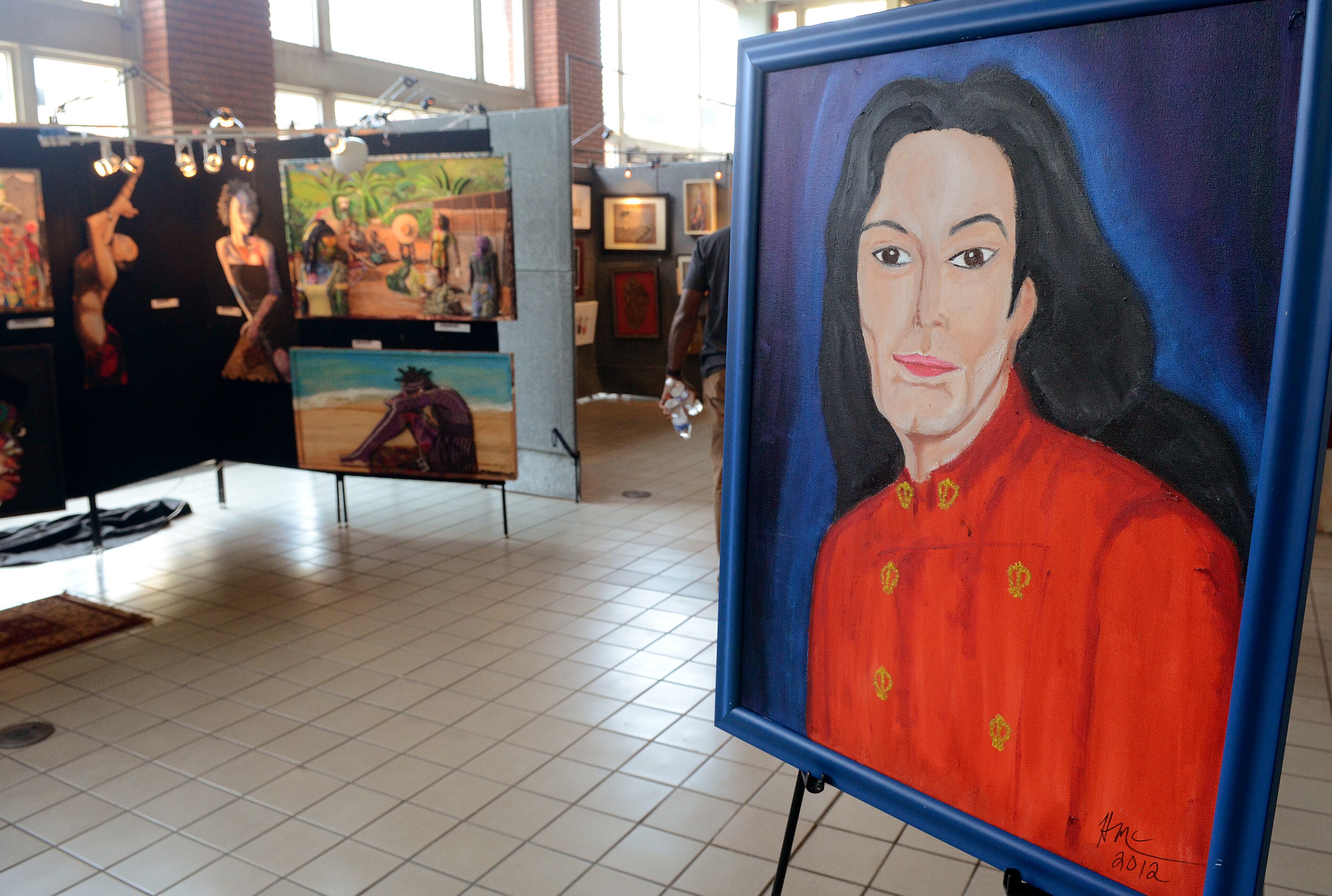 "The King" by artist Herman L. McClenton keeps an eye on the established artist area of the 19th Annual Heritage Arts and Soul Festival at Underground Atlanta. (CHRIS HUNT/SPECIAL)