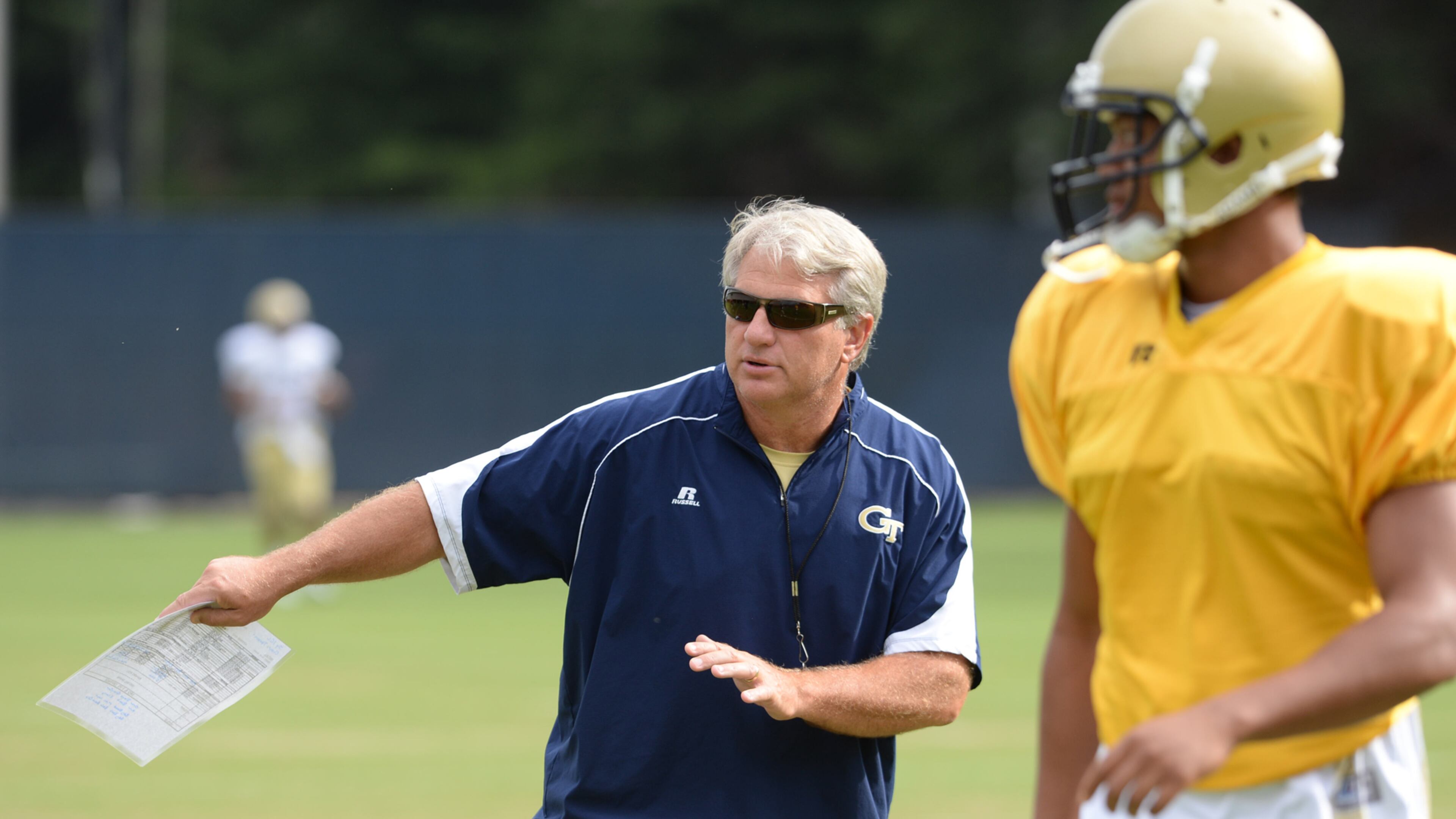 Defensive coordinator Ted Roof gives instructions to his defensive backs during Georgia Tech football practice. JOHNNY CRAWFORD / JCRAWFORD@AJC.COM