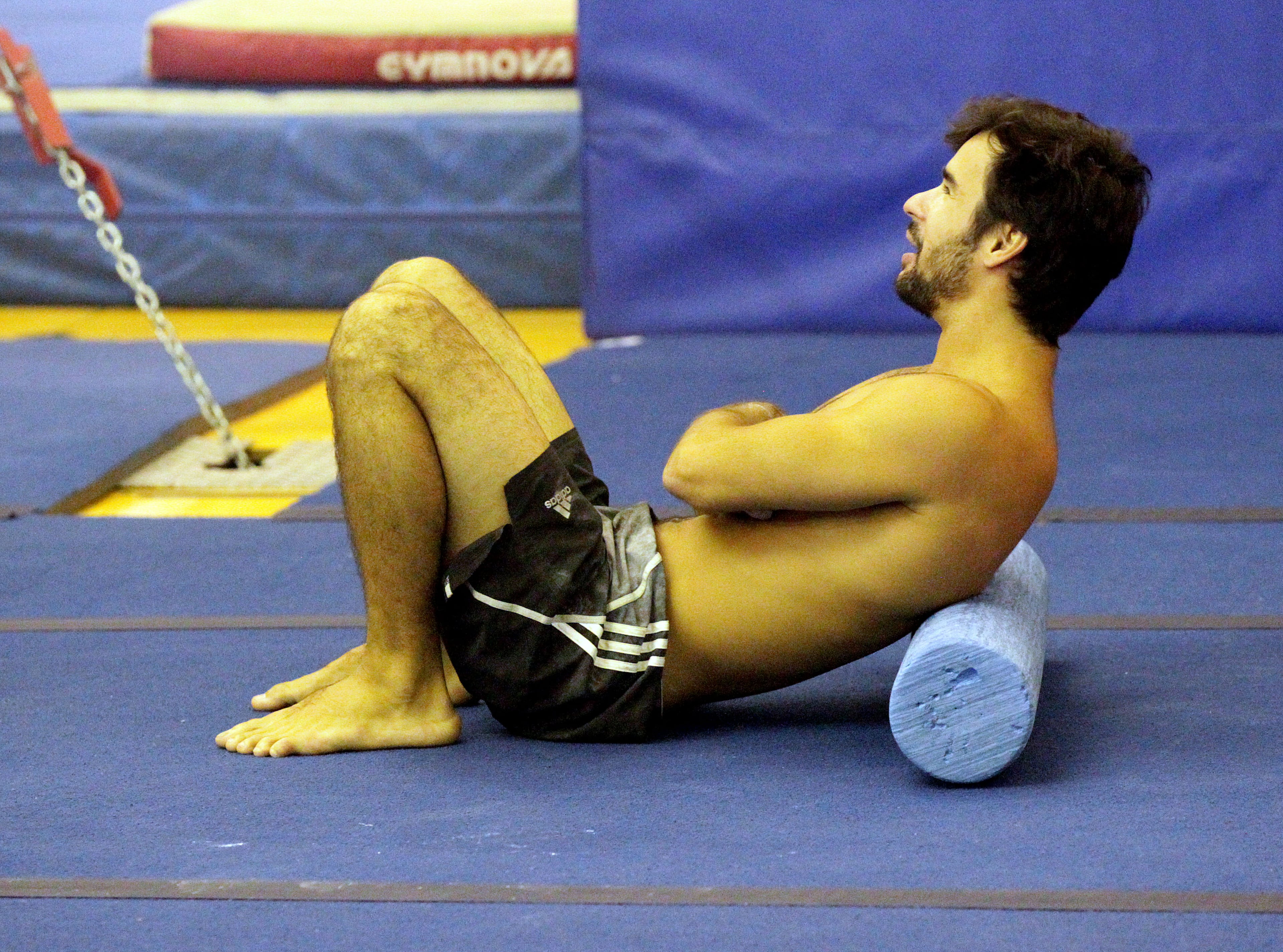 Fabio Santos relaxes while watching other artists rehearse. The show features 52 artists from 17 countries speaking 11 different languages.