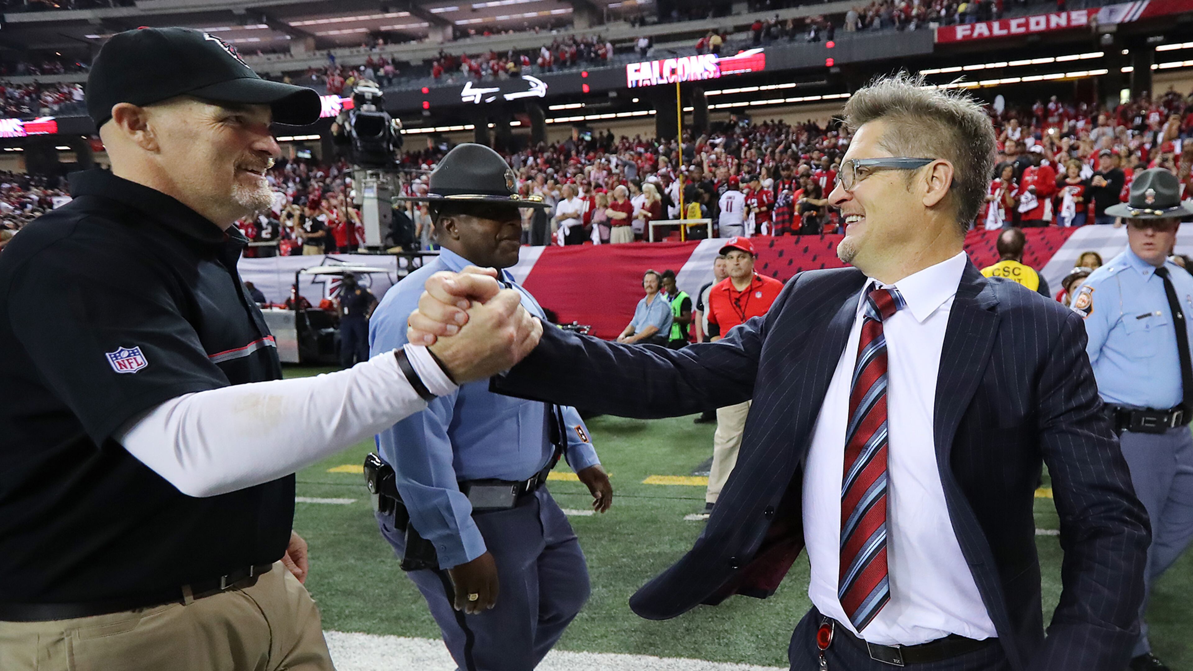 January 14, 2017, Atlanta: Falcons head coach Dan Quinn and General Manager Thomas Dimitroff celebrate a 36-20 victory over the Seahawks in a NFL football NFC divisional playoff game on Saturday, Jan. 14, 2017, in Atlanta. Curtis Compton/ccompton@ajc.com