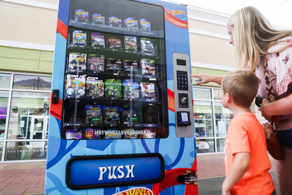 Hot Wheels vending machine owner Kristen Albert said she knew kids would enjoy the machines, but was surprised to see how passionate adults are, as well. (Abbey Cutrer/AJC)