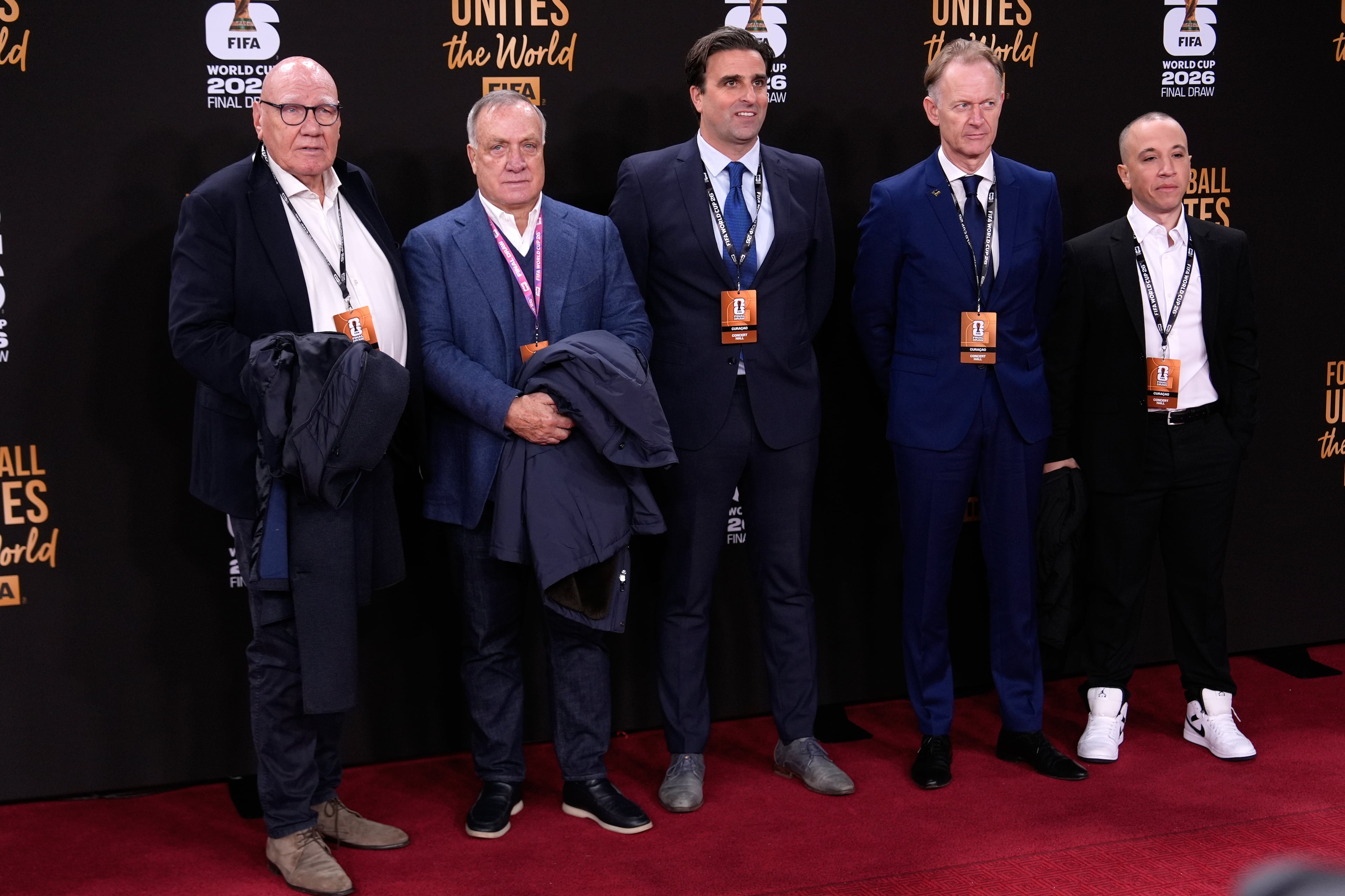 Curacao's coach Dick Advocaat, 2nd left, arrives to attend the draw for the 2026 soccer World Cup at the Kennedy Center in Washington, Friday, Dec. 5, 2025. (AP Photo/Julia Demaree Nikhinson)