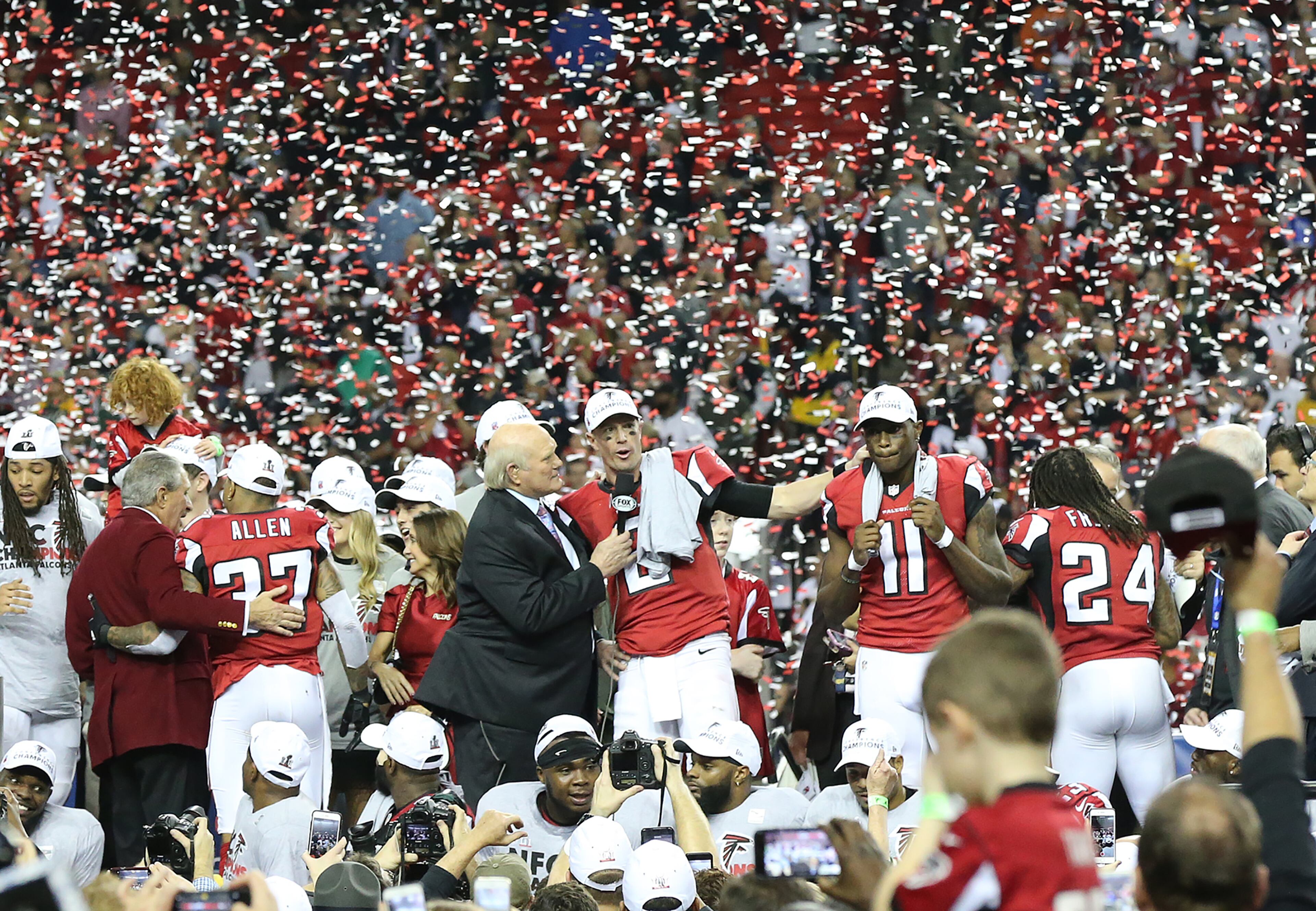 January 22, 2017, Atlanta: Arthur Blank, Matt Ryan, Julio Jones and the Falcons celebrate beating the Packers 44-21 in the NFL football NFC Championship game on Sunday, Jan. 22, 2017, in Atlanta. Curtis Compton/ccompton@ajc.com