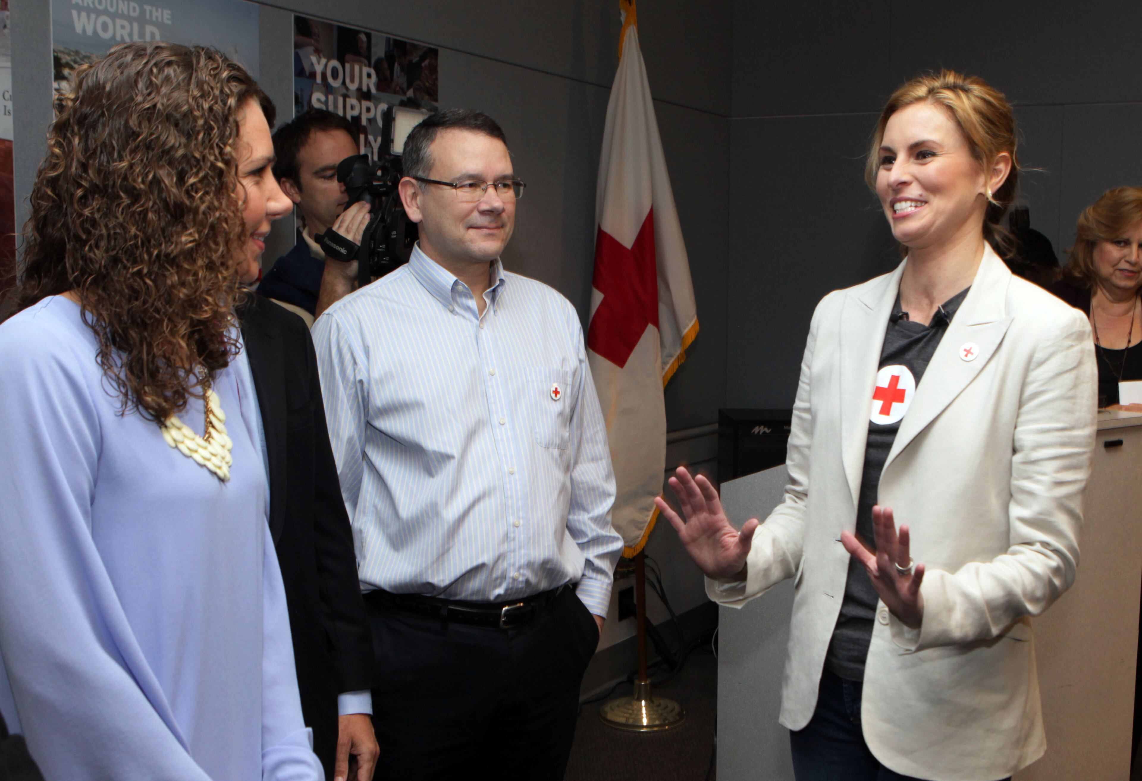 Rachel Holt (left) & Fred Robertson (right) listen to Supermodel Niki Taylor thank them as she met some of the blood donors that helped save her life after 2001 car accident during a luncheon at the American Red Cross offices in Atlanta on Tuesday Weds., March 20th, 2013.