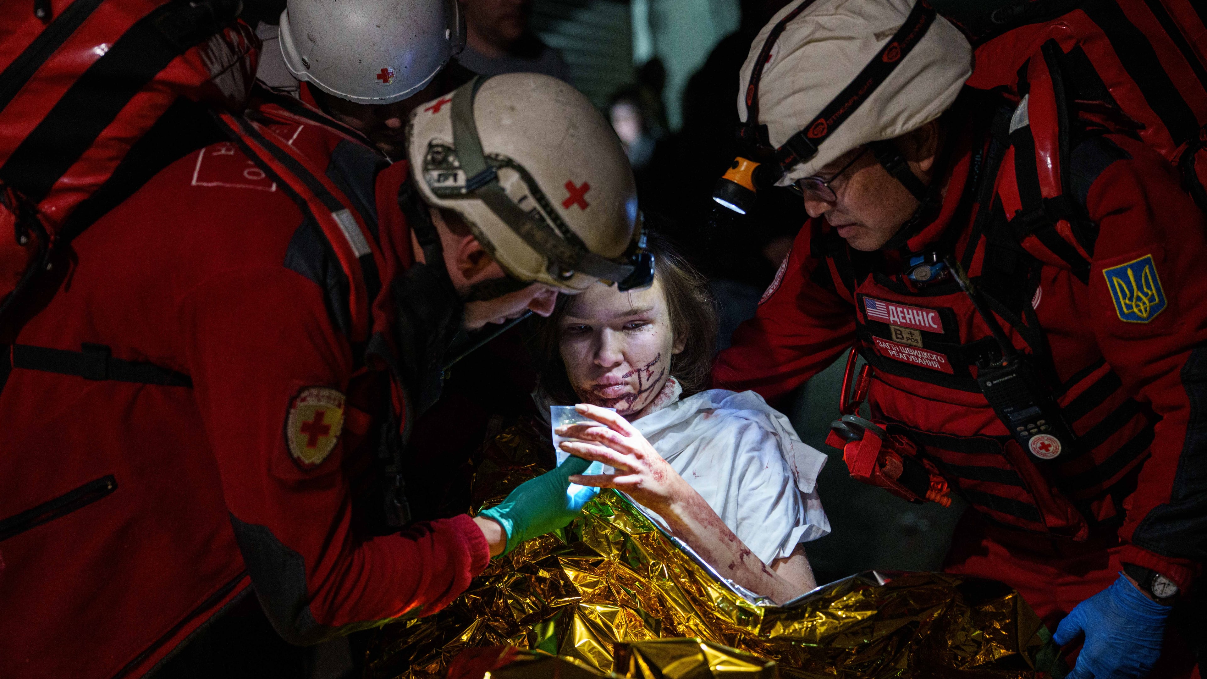 Red Cross volunteers help an injured woman in a shelter after a Russian strike on a residential neighborhood in Kyiv, Ukraine, on Sunday, May 24, 2026. (AP Photo/Evgeniy Maloletka)