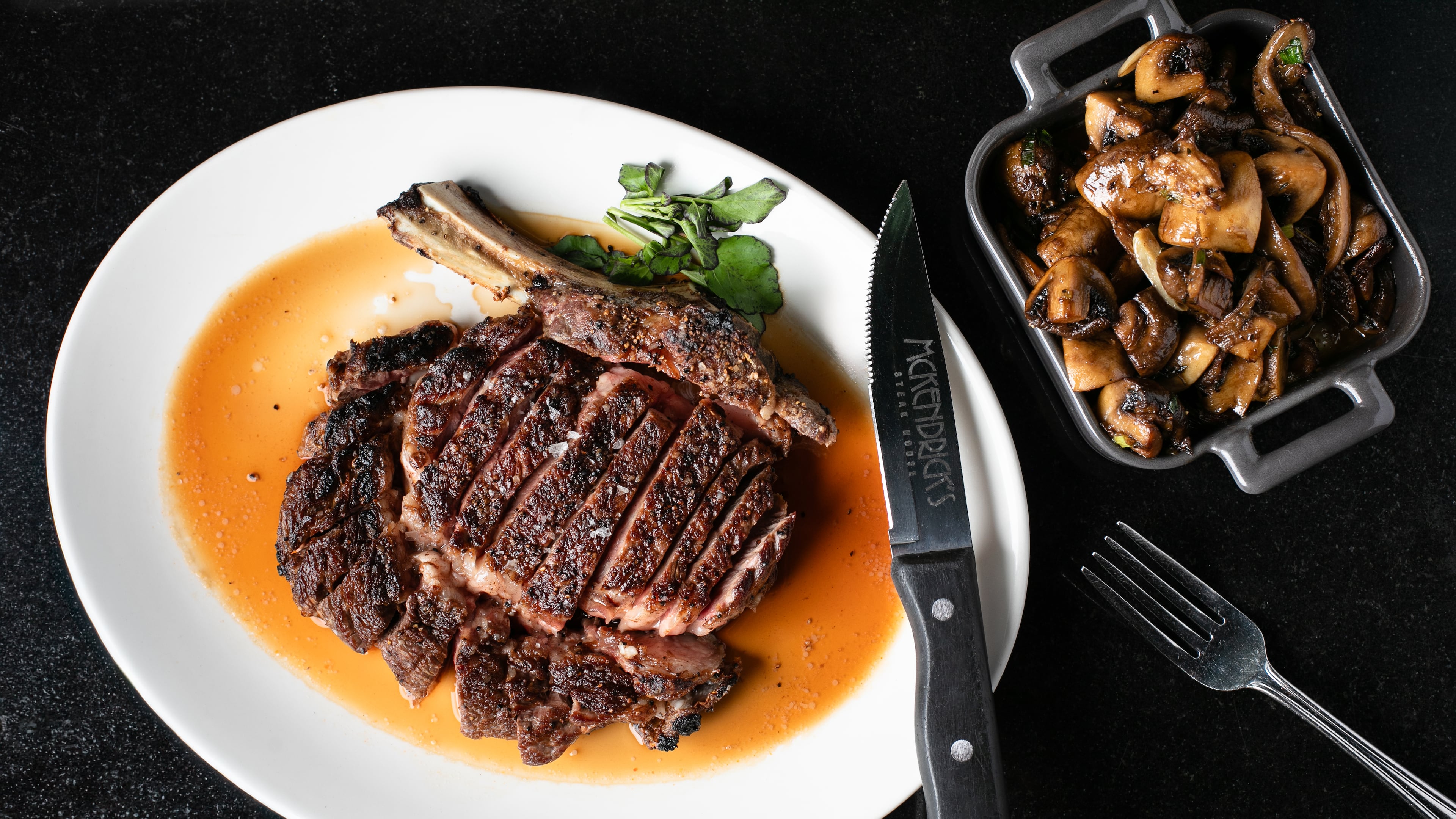 The crowning steak on the McKendrick's menu is a 30-ounce, 30-day dry-aged tomahawk rib-eye. (Erik Meadows Photography/Courtesy of McKendrick's Steakhouse & Bar)