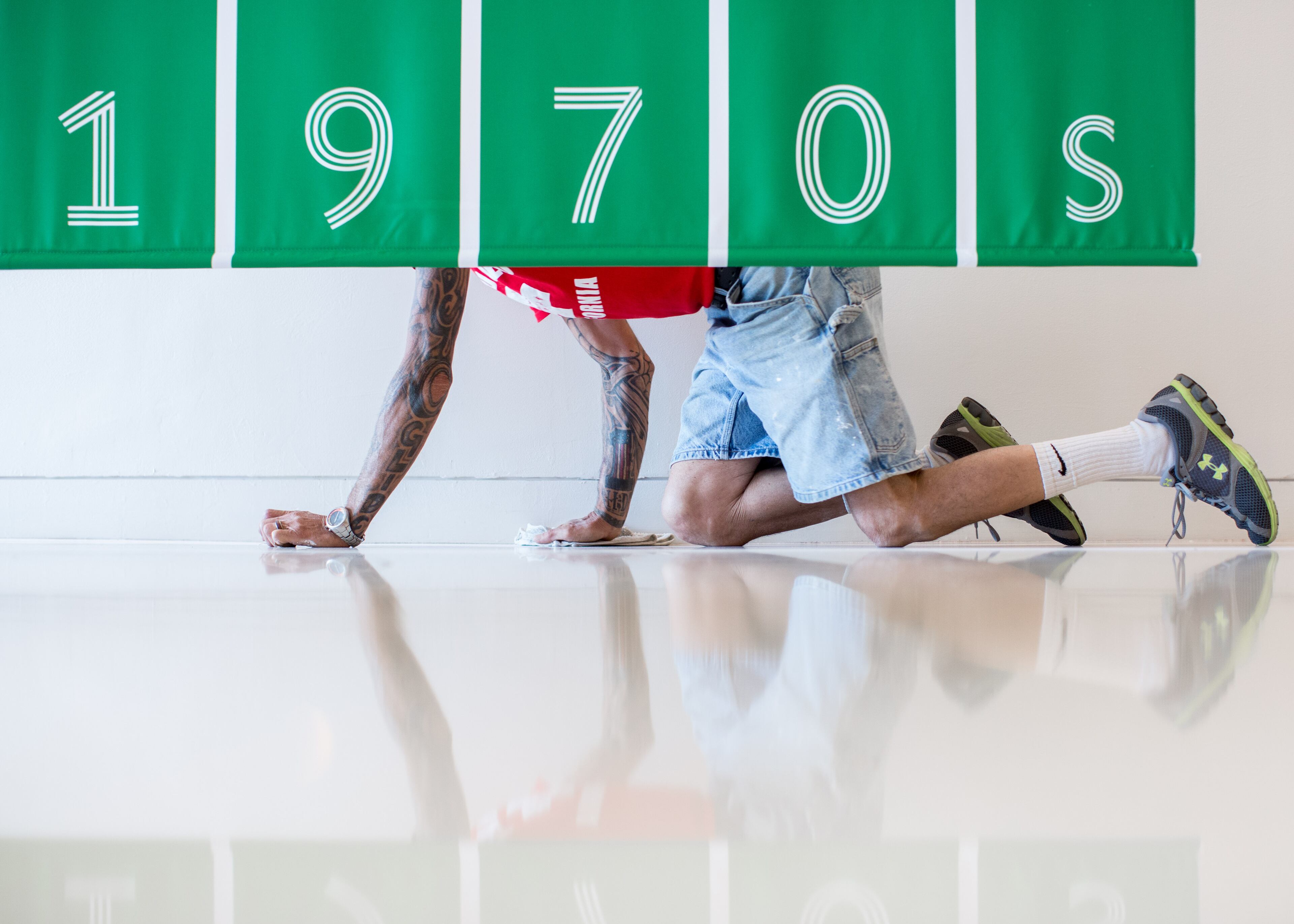 A worker puts the final touches on the "Forward Together: A Look at Atlanta's LGBT History Since Stonewall" exhibit on display at the Center for Civil and Human Rights, Tuesday, Sept. 1, 2015, in Atlanta. Leaders of an Atlanta museum want the space focused on modern and historic civil rights to contribute to a national push to ensure LGBT rights, particularly in southern states. (AP Photo/Branden Camp)