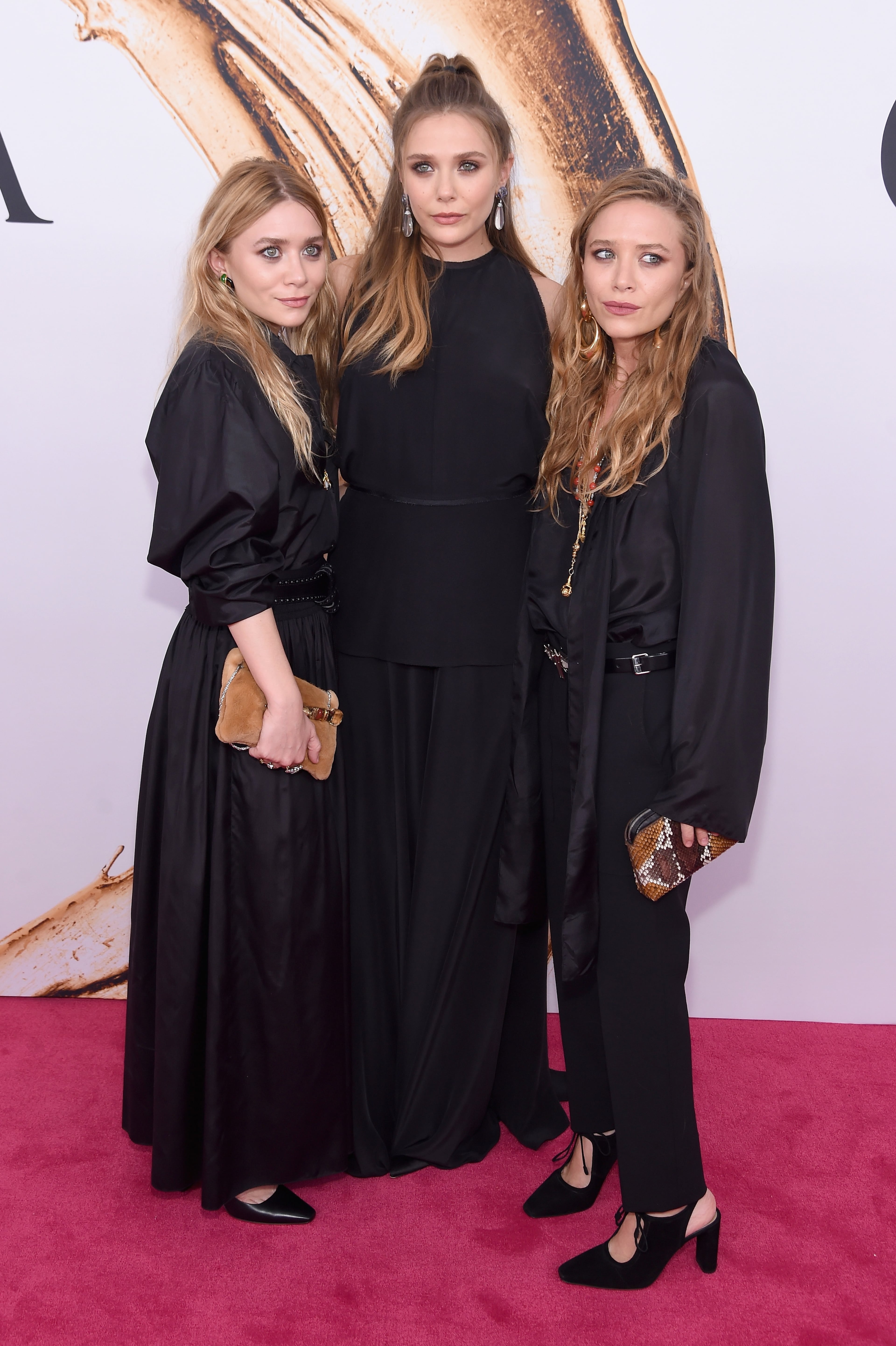NEW YORK, NY - JUNE 06: Elizabeth Olsen (center) and Mary-Kate and Ashley attend Olsen the 2016 CFDA Fashion Awards at the Hammerstein Ballroom on June 6, 2016 in New York City. (Photo by Jamie McCarthy/Getty Images)