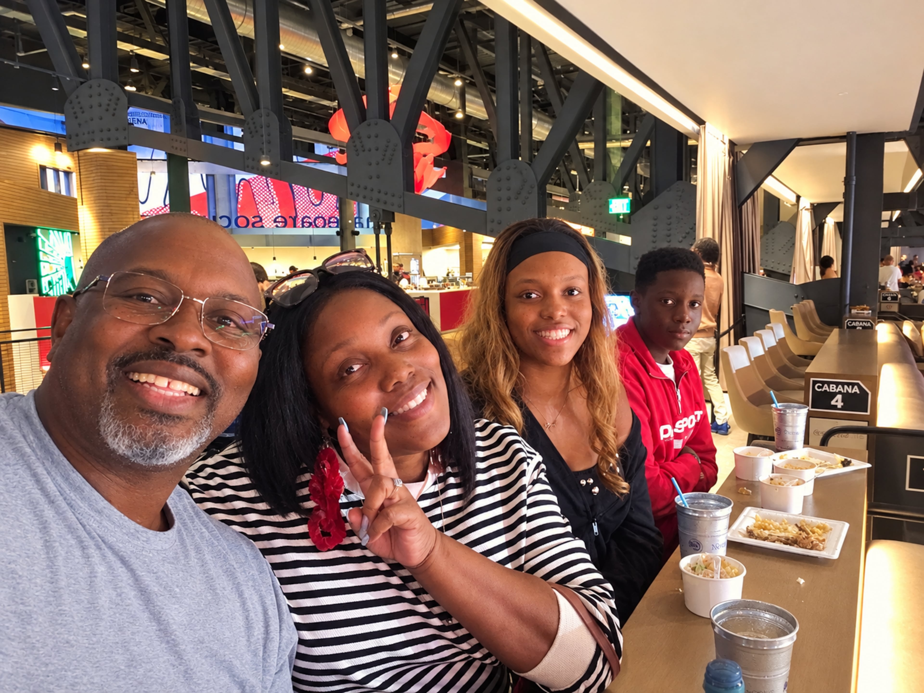 Maria Tolbert (second from left) enjoys a Hawks game earlier this year with her family, from left, Kenyatta, Kennedi and Kaleb. (Courtesy of the Tolbert family)