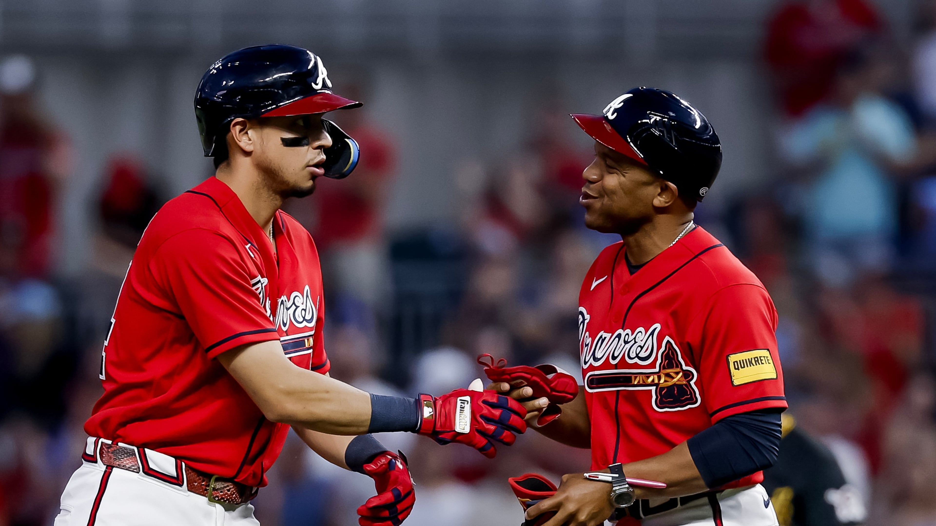 Atlanta Braves' Mauricio Dubon, left, reacts with first base coach Antoan Richardson, right, after hitting an RBI double against the Pittsburgh Pirates during the fifth inning of a baseball game, Friday, June 5, 2026, in Atlanta. (Erik S. Lesser/AP)