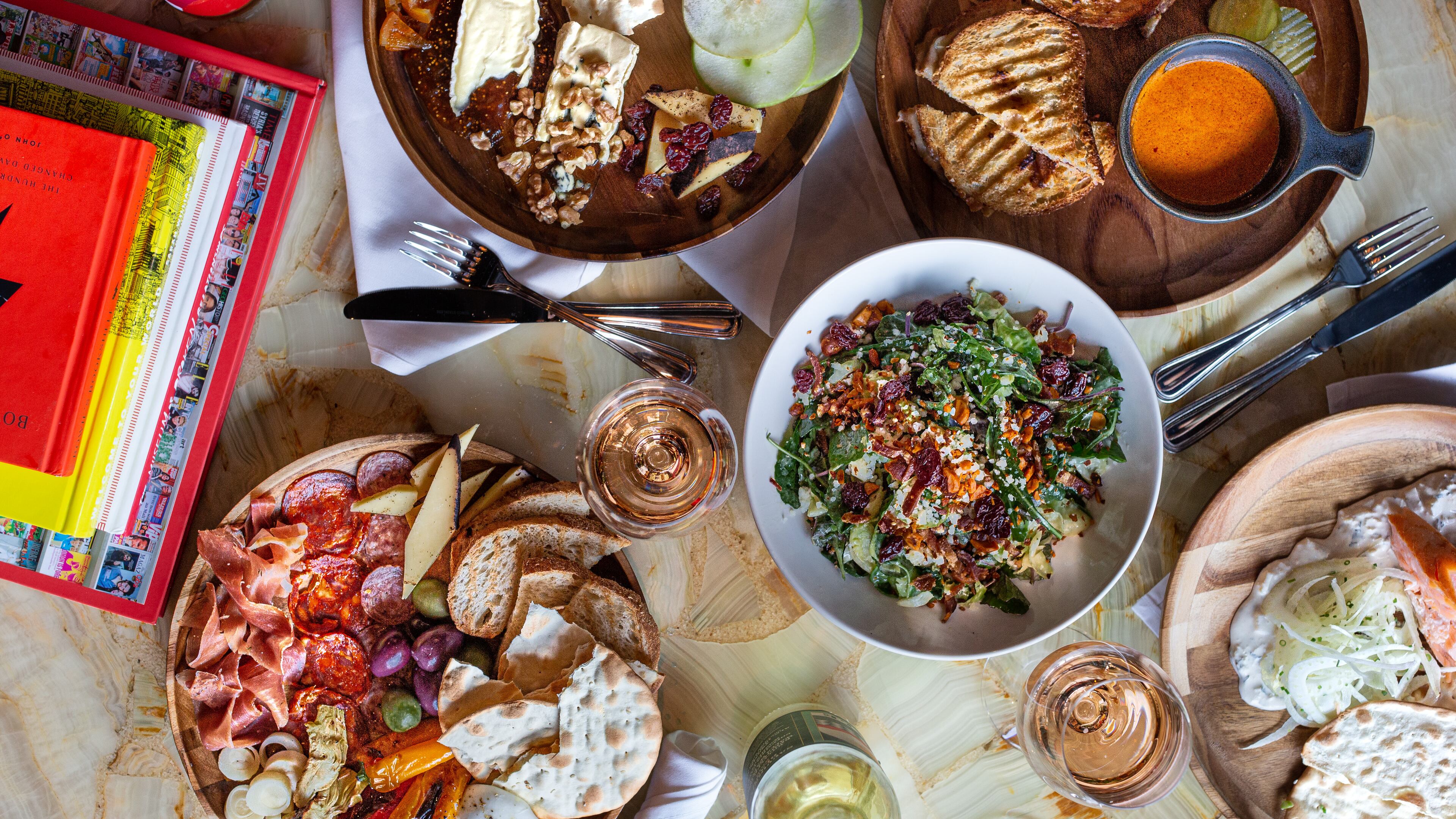 Postino WineCafé's mission is to serve everyone from wine enthusiasts to casual sippers with a carefully curated selection of wine by the glass or bottle and a menu featuring charcuterie boards, bruschetta, paninis, soups, salads, and more. Photo courtesy of Postino WineCafé.