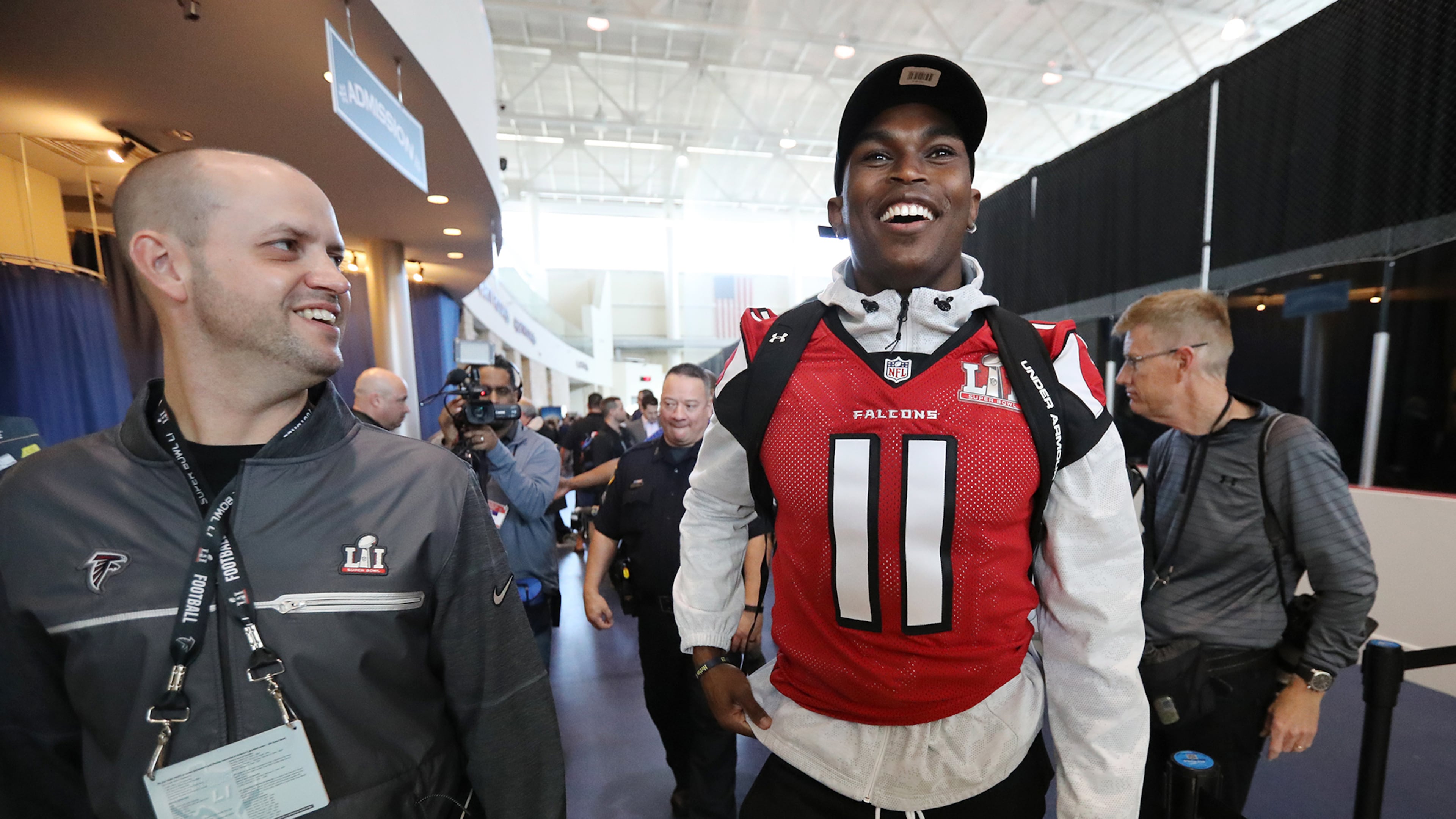 February 1, 2017, Houston: Falcons wide receiver Julio Jones shares a laugh with Brian Cearns, director of football communications, as they leave at the conclusion of Super Bowl media availability on Wednesday, Feb. 1, 2017, at the Memorial City Mall ice arena in Houston. Curtis Compton/ccompton@ajc.com