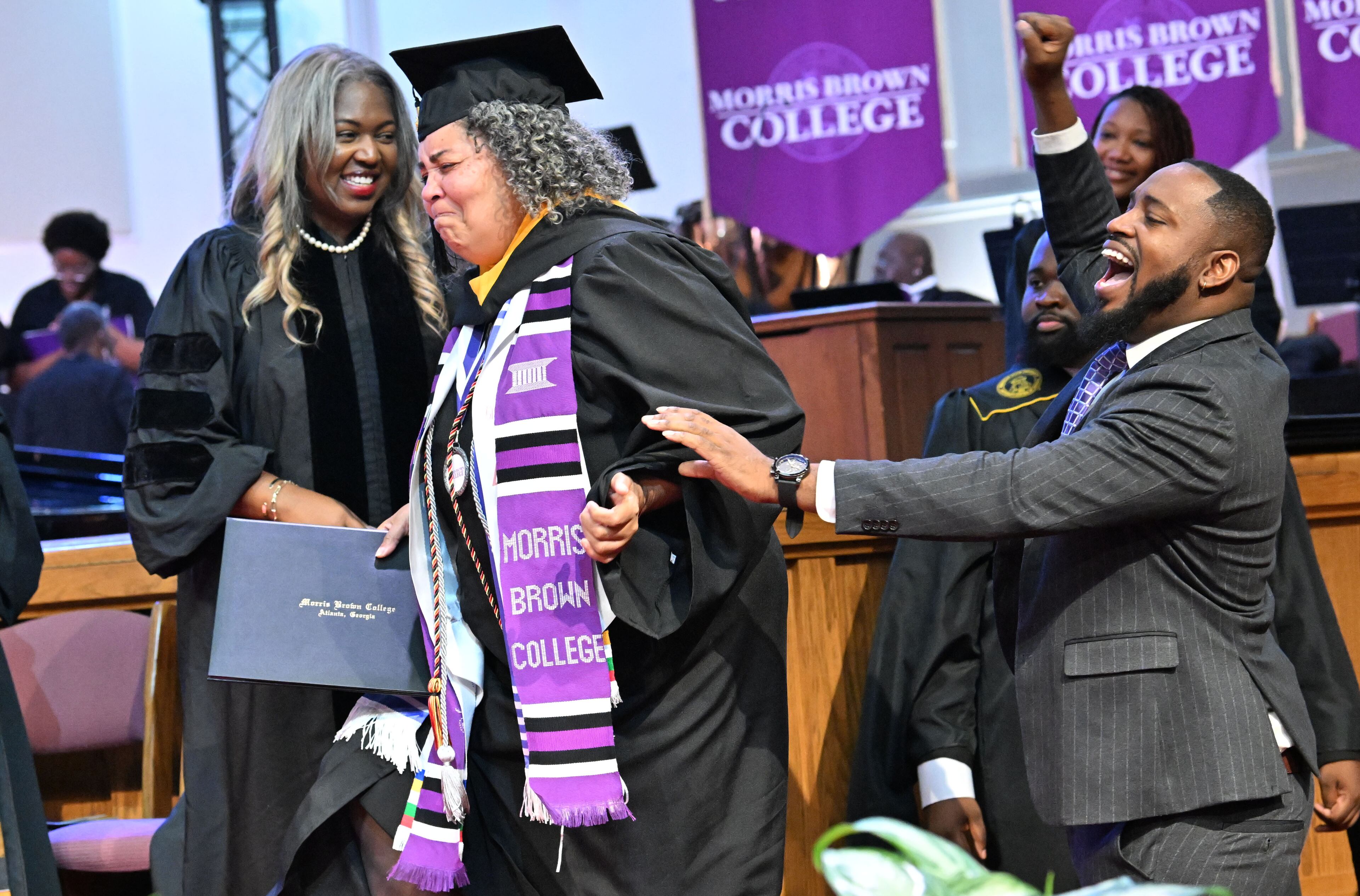 Artrisia Edwards reacts before she receives her degree during 2025 Morris Brown College commencement exercises at Saint Philip A.M.E. Church, Saturday, May 17, 2025, in Atlanta. (Hyosub Shin / AJC)