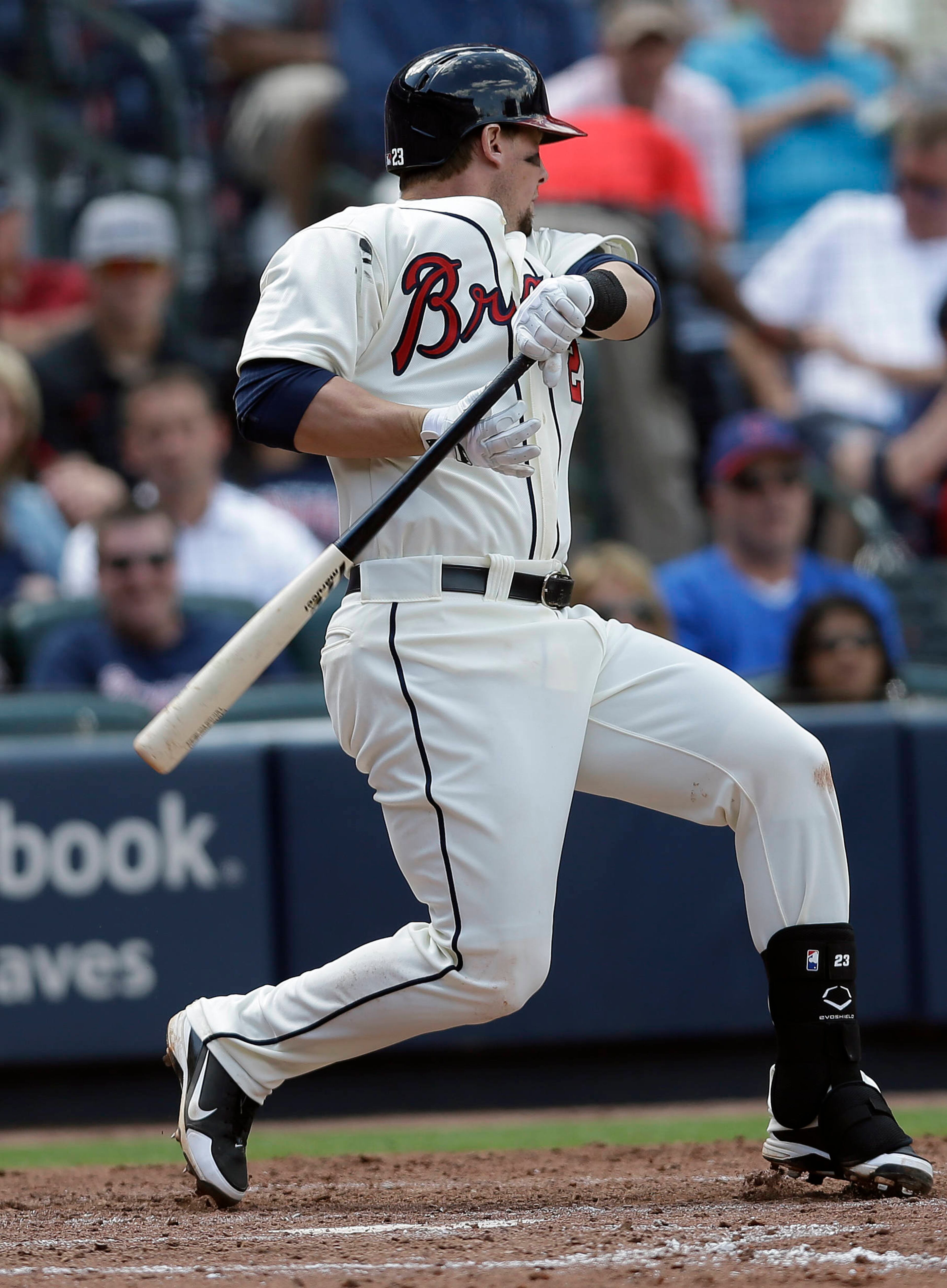 Atlanta Braves' Chris Johnson (23) falls to the ground after being hit by a pitch in the sixth inning.