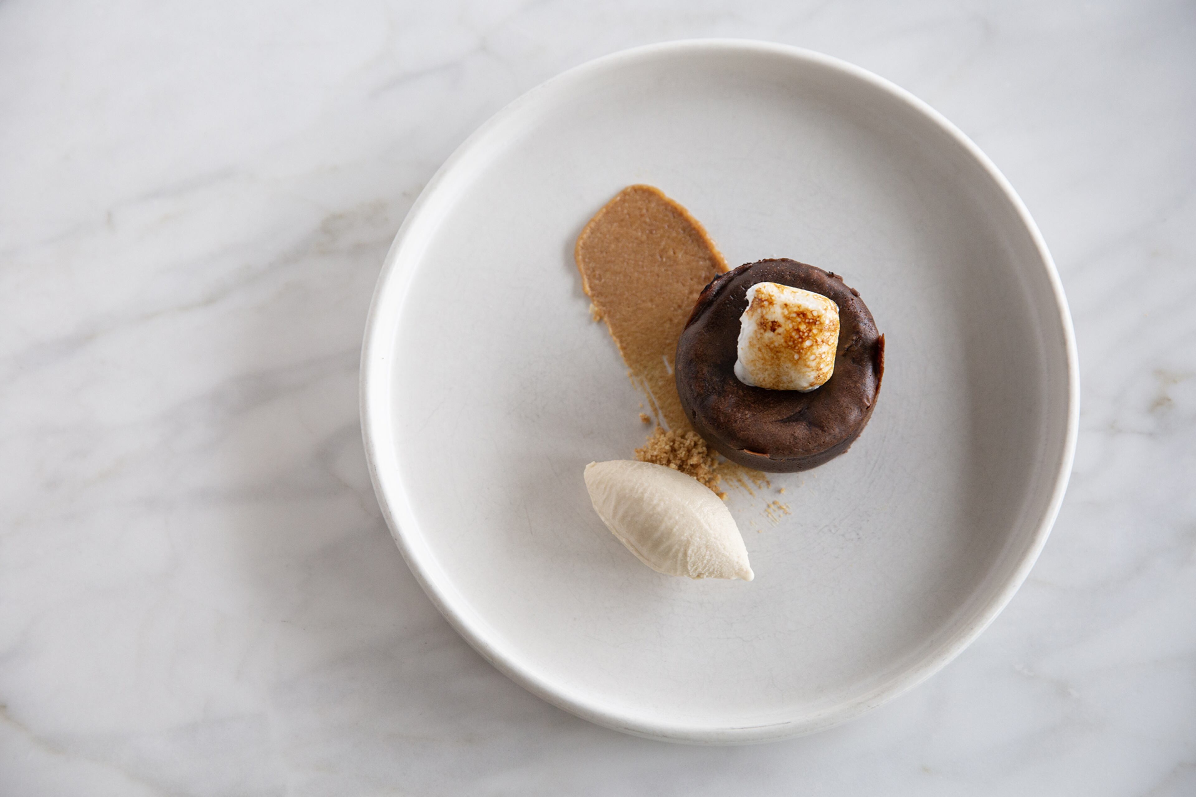 Warm Chocolate Cakes With Soft Centers is a warm and gooey dessert that's so popular it's sold in little tins for people to take home and bake.