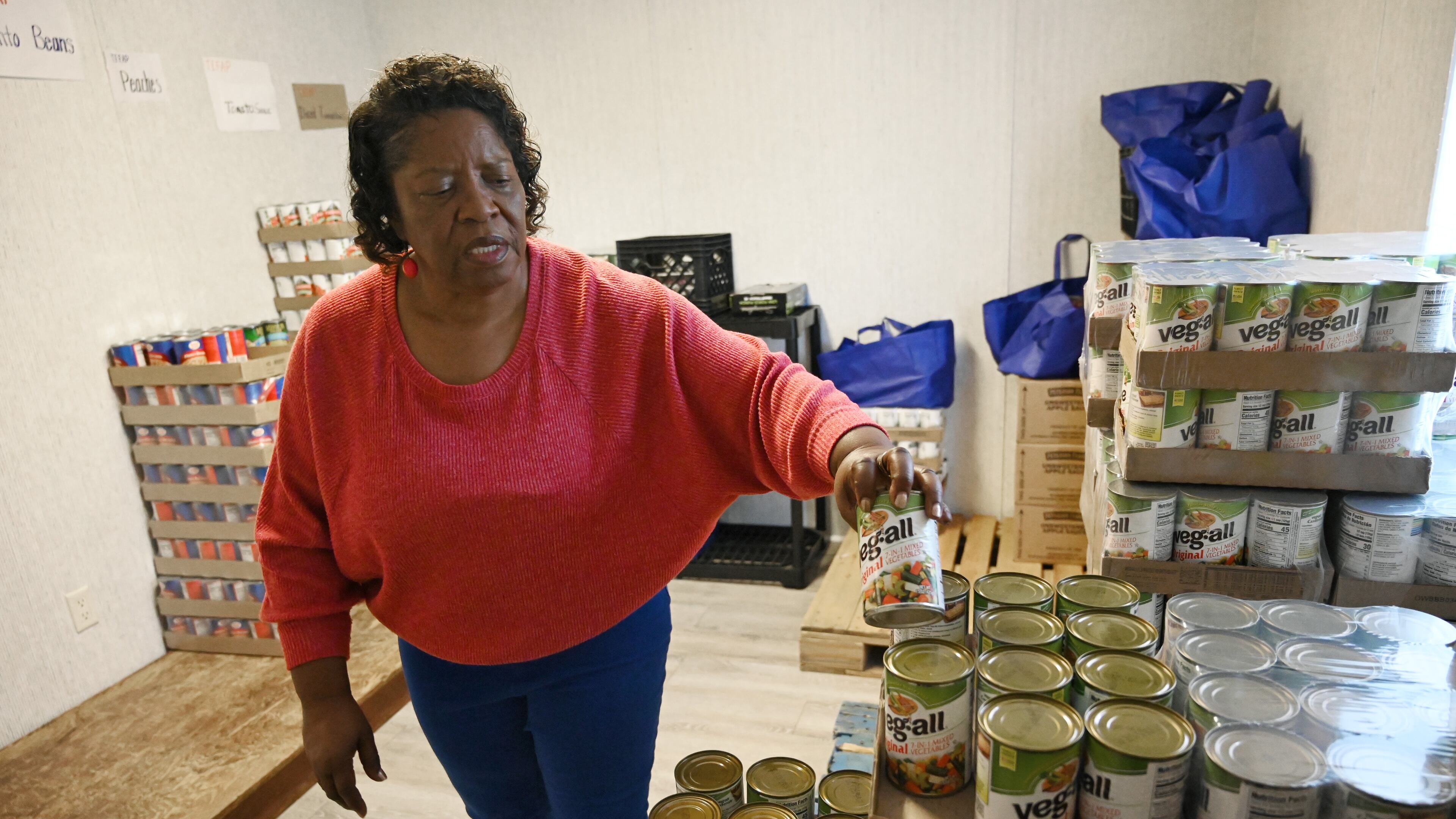 Gloria Simmons, food pantry manager at Hancock Helping Hands, shows the inventory on Tuesday, October 7, 2025. (Hyosub Shin/AJC)