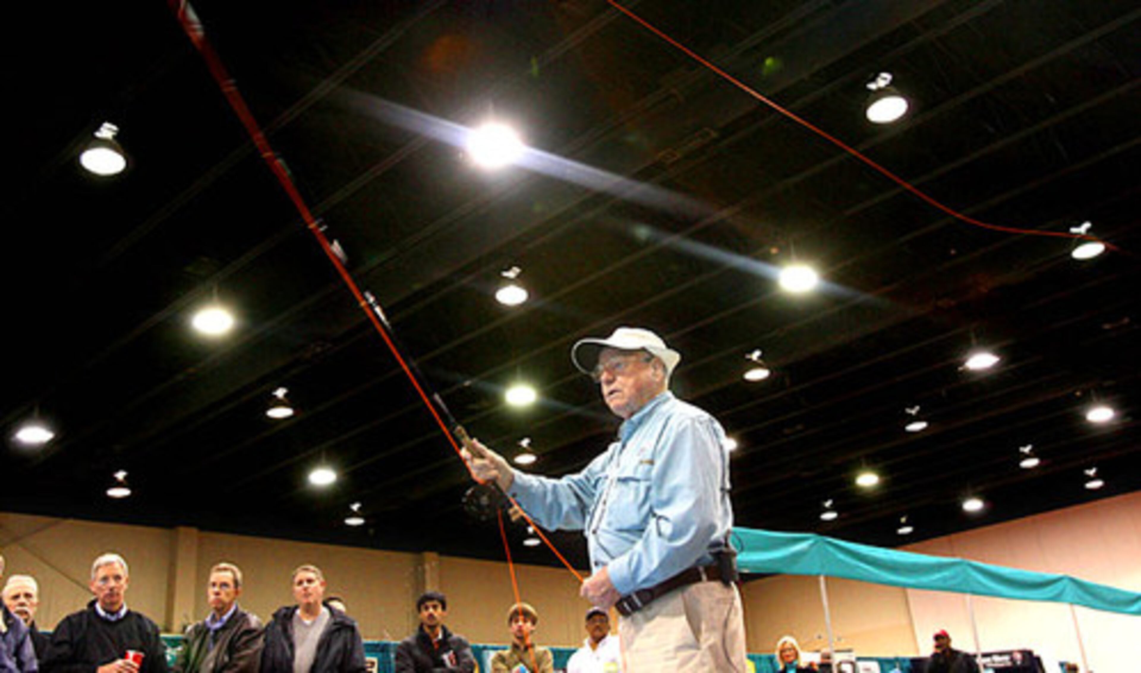 "Lefty" Kreh casts inside the lights of the Gwinnett Center.
