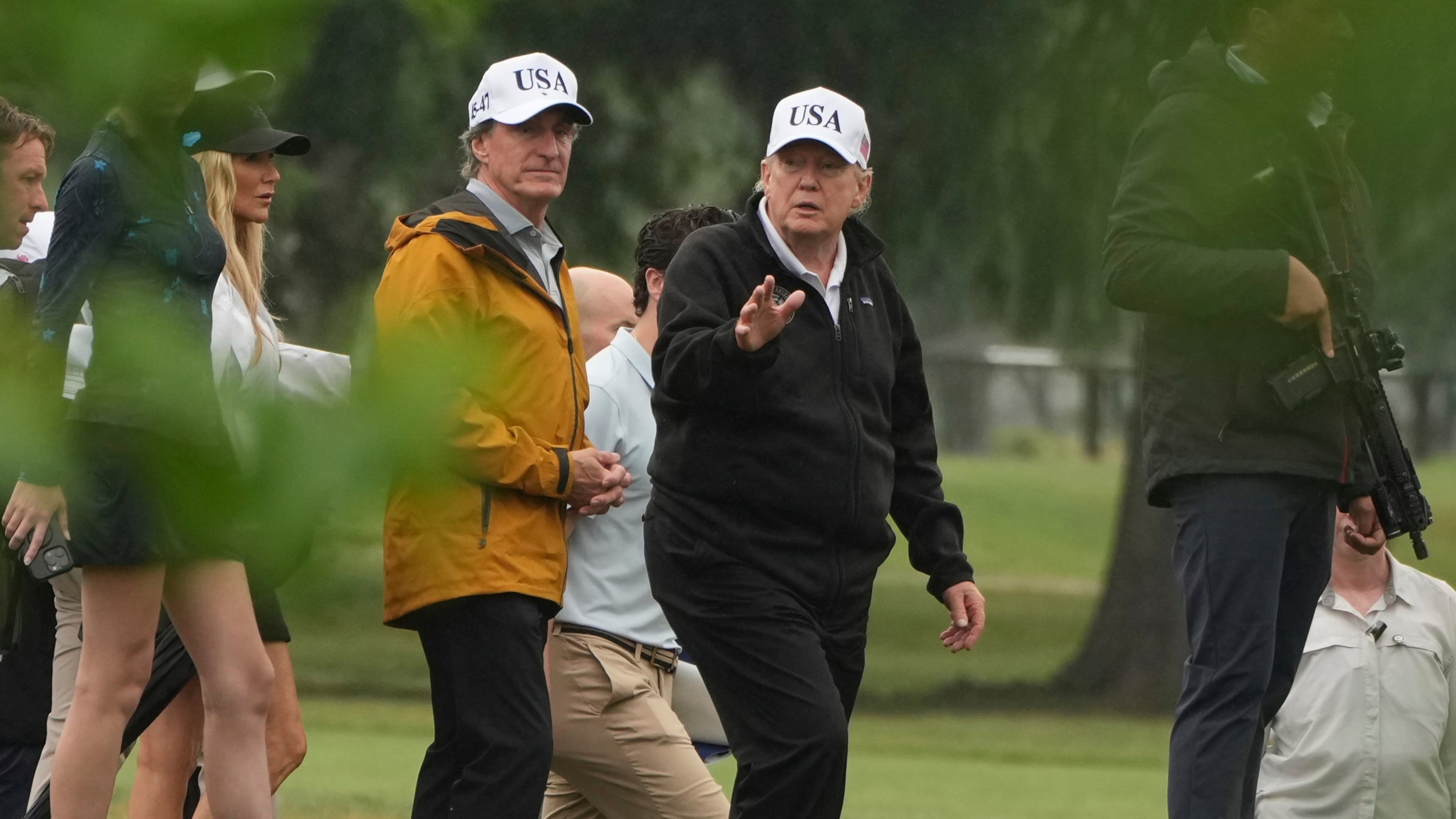 FILE - President Donald Trump, right, and Interior Secretary Doug Burgum tour the East Potomac Park golf course, June 28, 2026, in Washington. (AP Photo/Mark Schiefelbein, File)