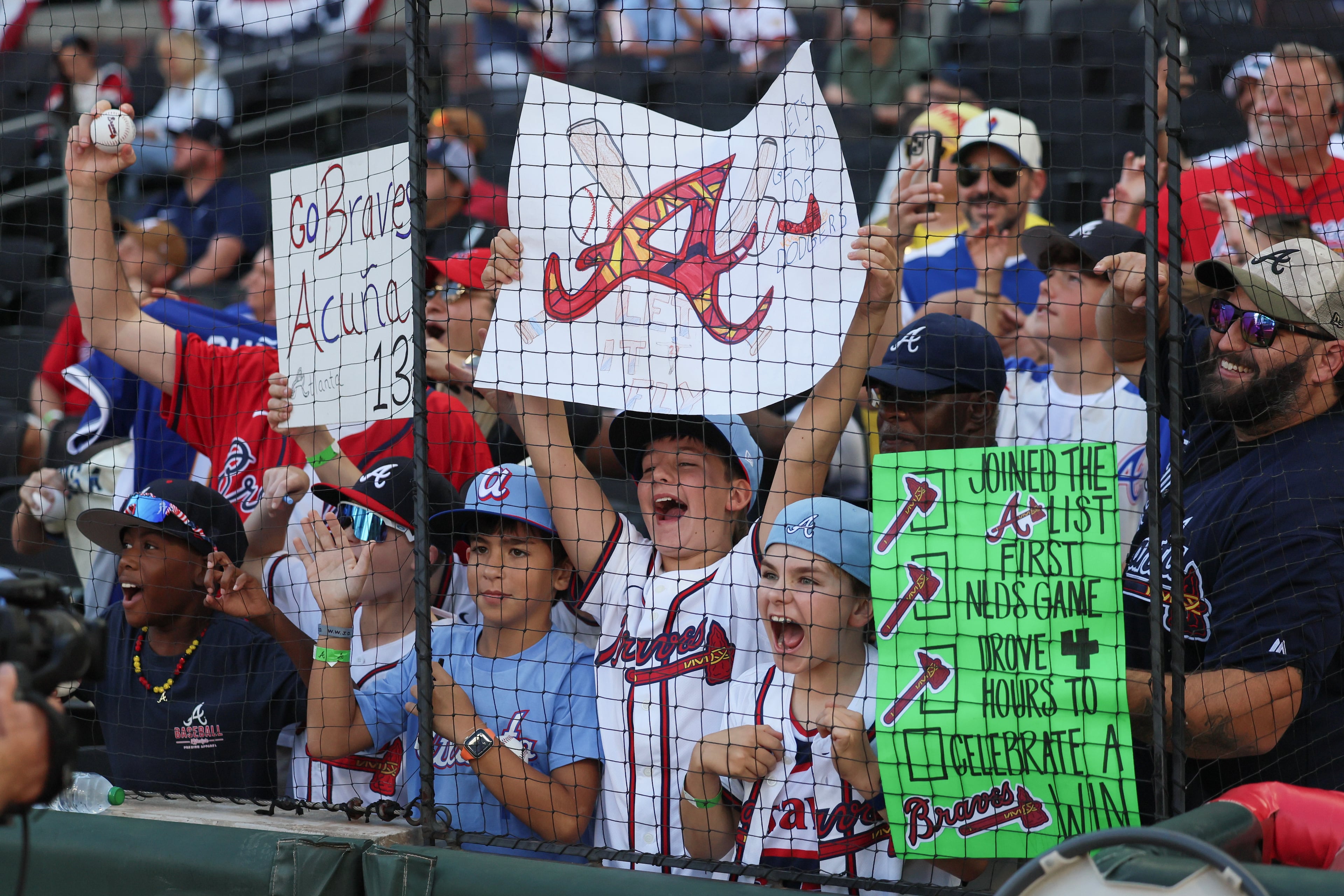 Young Atlanta Braves fans cheer before Game 3 of the MLB National League Division Series between the Atlanta Braves and the Los Angeles Dodgers, Tuesday, Oct. 6, 2026, in Atlanta. (Jason Getz/AJC)